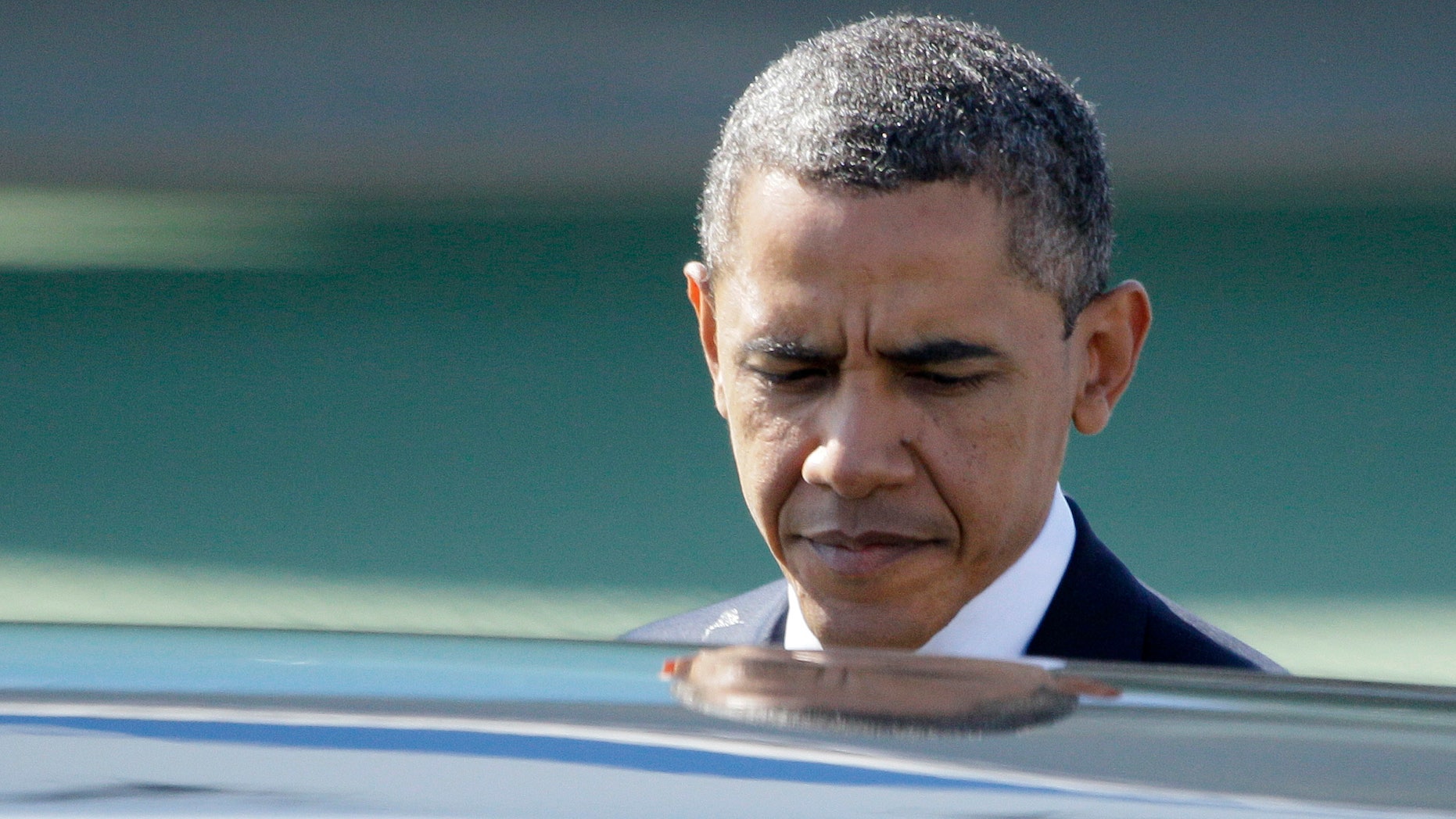 President Obama prepares to enter his limousine after arriving at San Francisco International airport in San Francisco, Tuesday, Oct. 25, 2011.