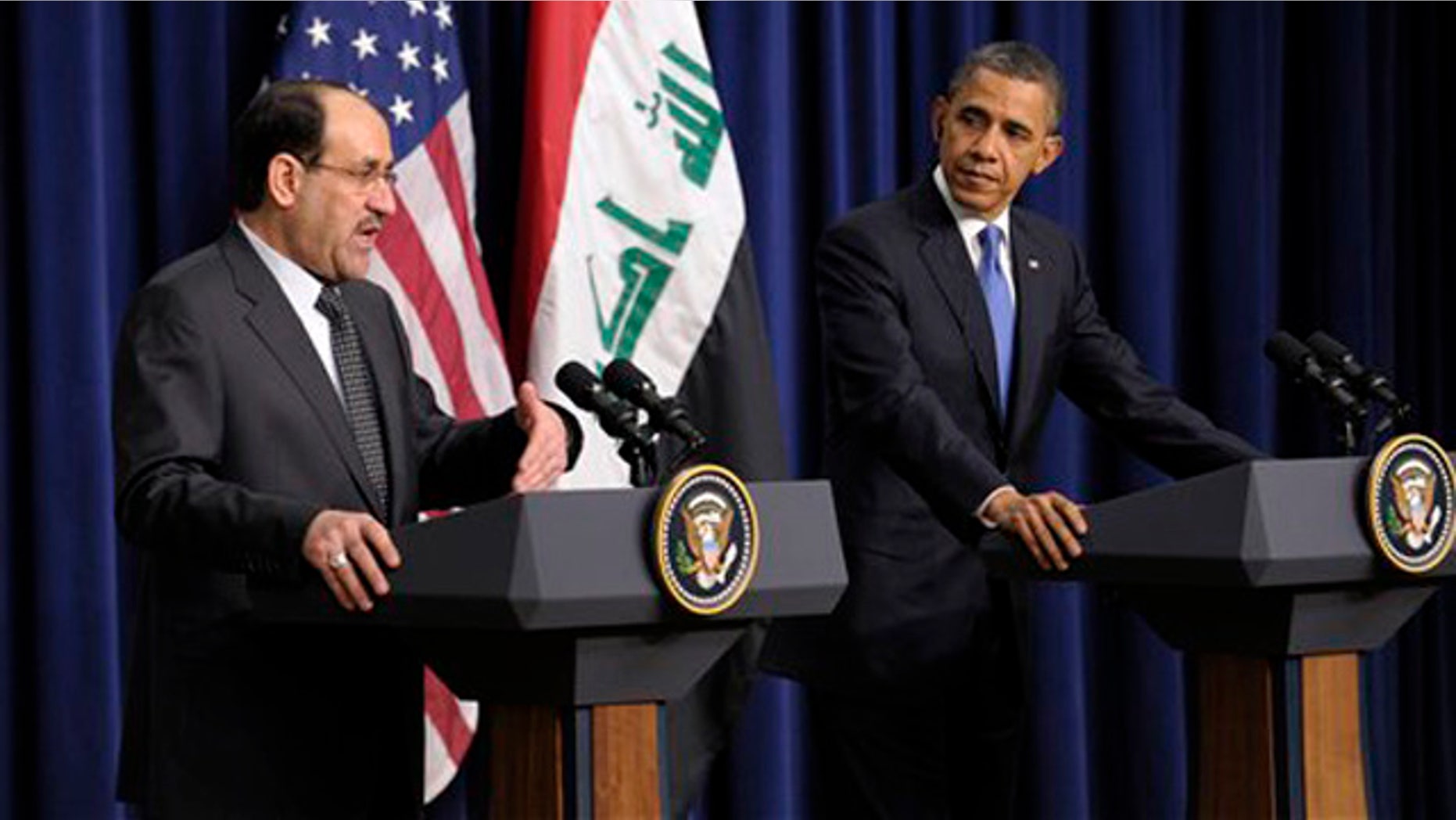 Dec. 12, 2011: President Obama listens as Iraq's Prime Minister Nouri al-Maliki speaks during a news conference at the White House in Washington.