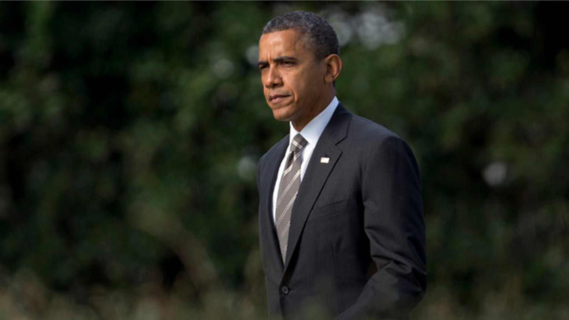 Sept. 26, 2012: President Obama walks from the Oval Office of the White House to Marine One, en route to Ohio.