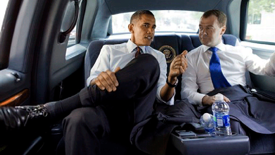 In this Thursday, June 24, 2010, photo Russian President Dmitry Medvedev, right, and President Obama speak as they ride to visit Ray's Hell Burger in Arlington, VA (AP)