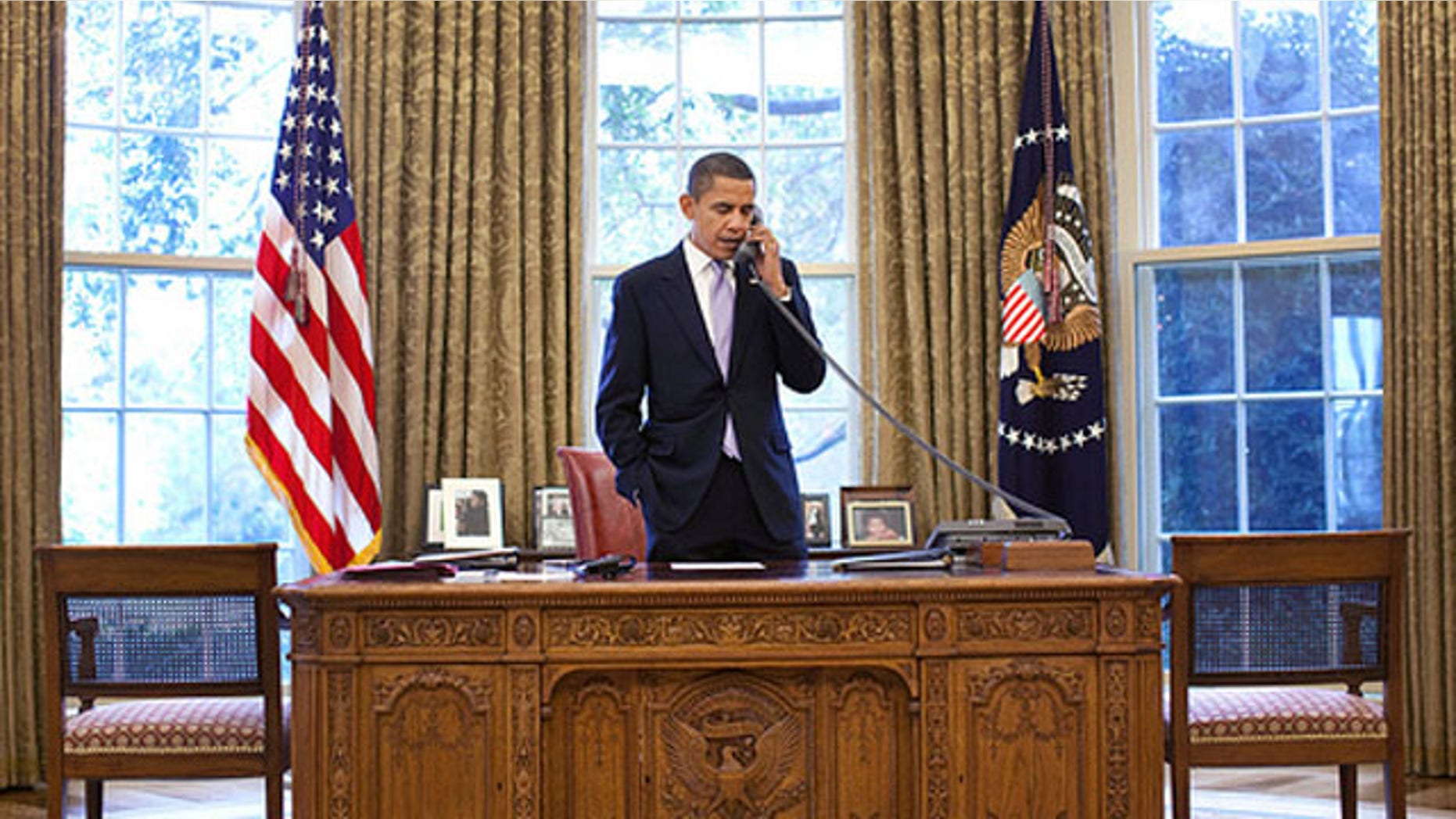 President Obama talks with Hamid Karzai about the Afghanistan election on a phone call from the Oval Office Nov. 2. (White House Photo)