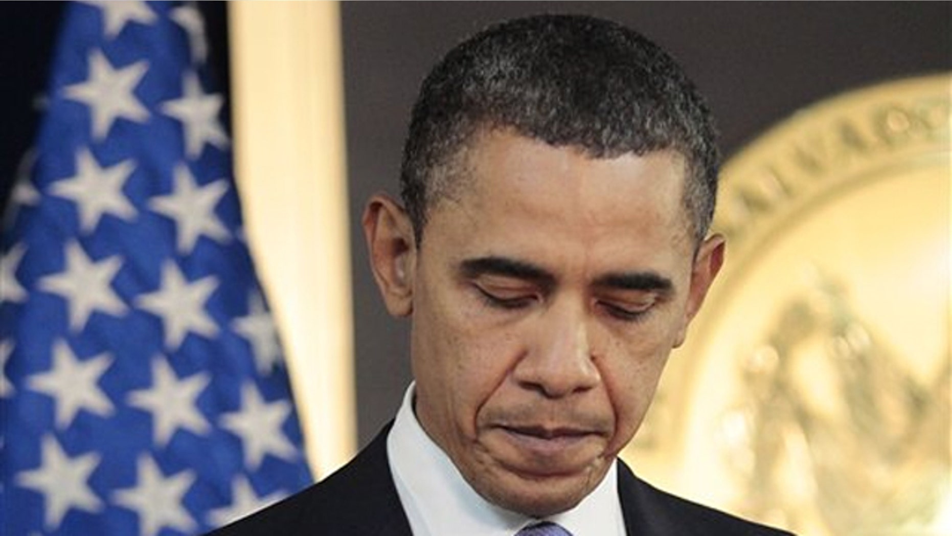 President Obama pauses after answering questions on the ongoing situation in Libya during a news conference in San Salvador, El Salvador, March 22.