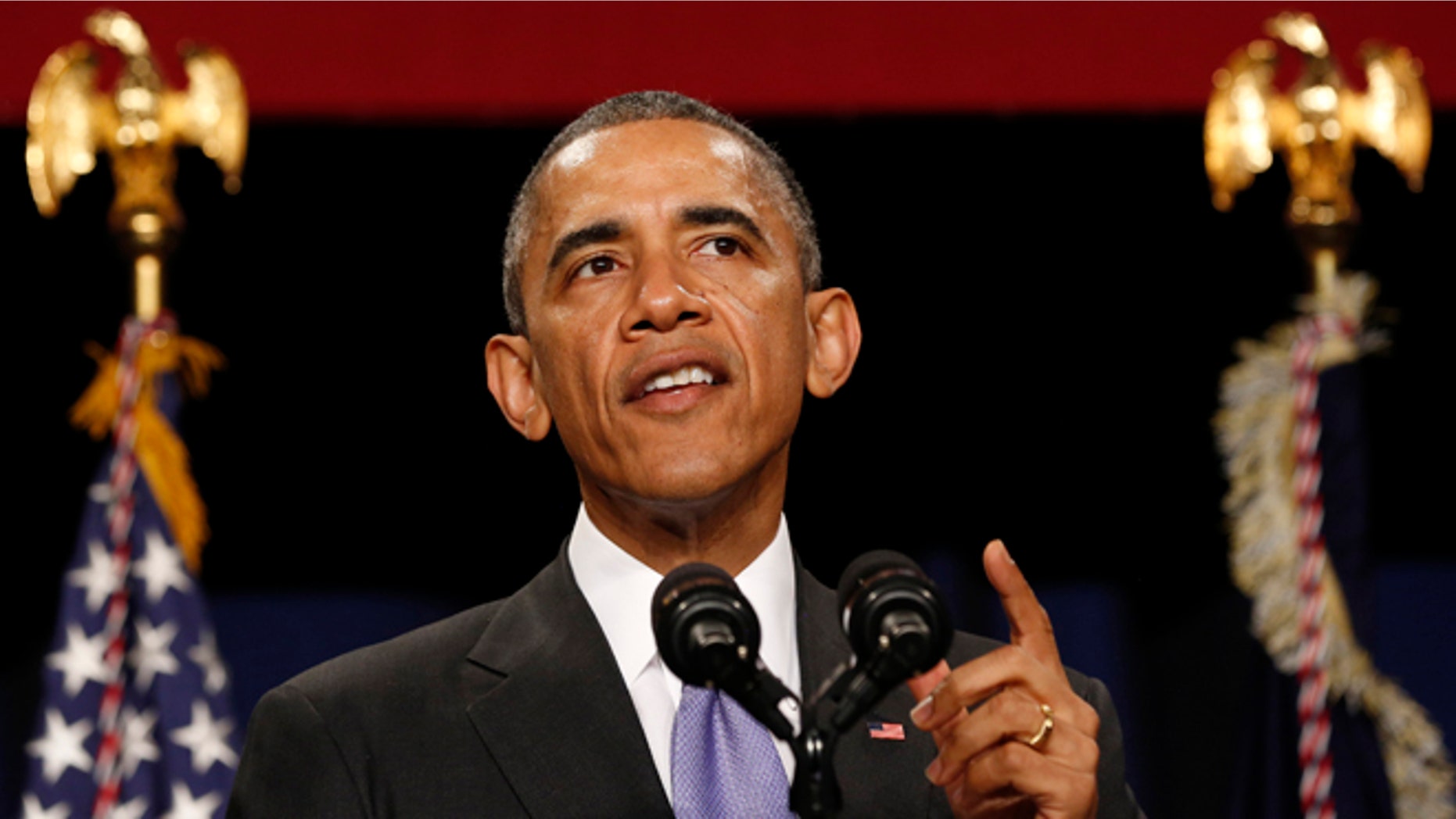 In this Tuesday, Dec. 9, 2014 photo, President Obama speaks at an event for the Senior Executive Service (SES) while at the Washington Hilton in Washington.