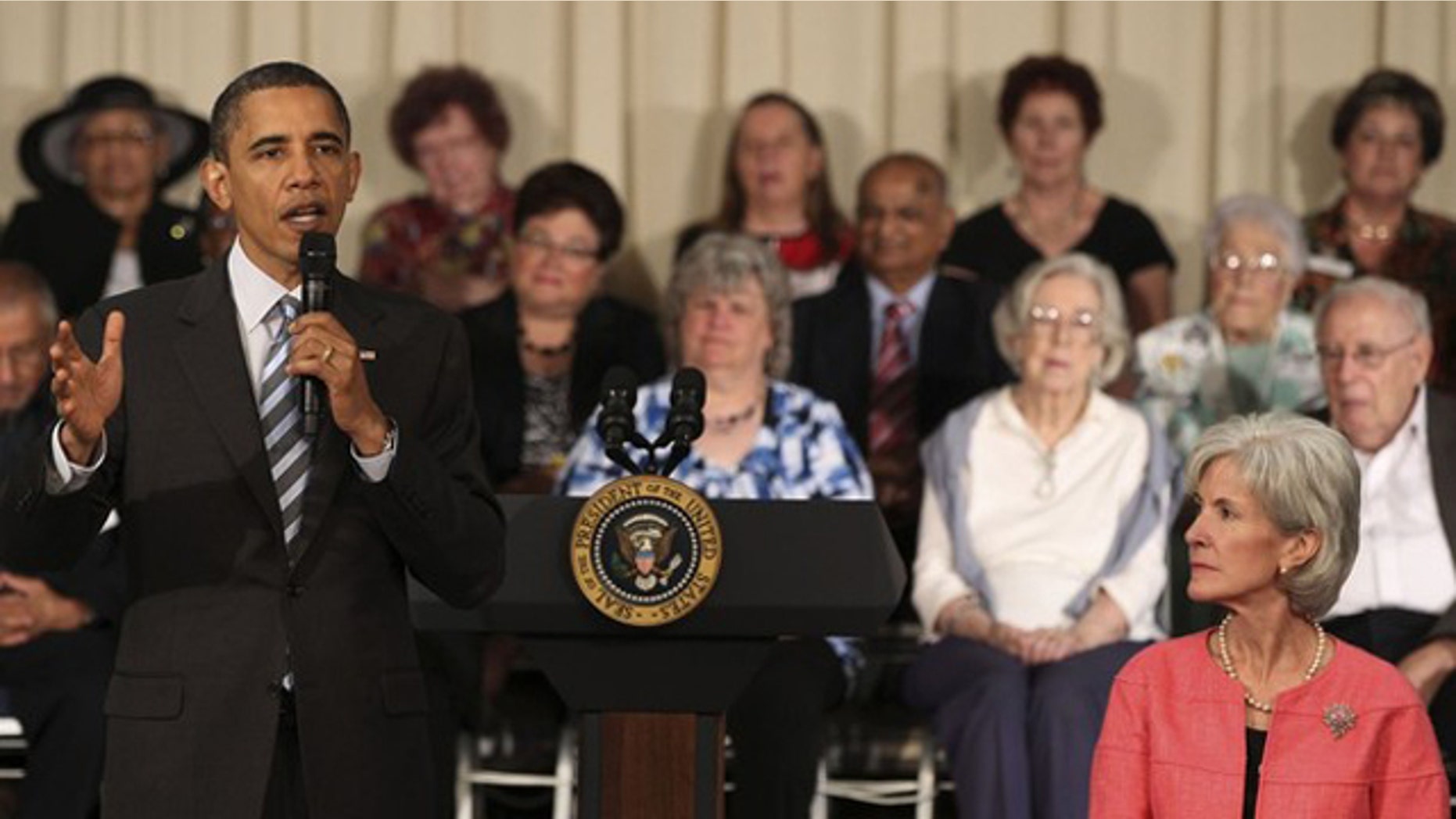 President Obama speaks next to Health and Human Services (HHS) Secretary Kathleen Sebelius (R) as he holds a town hall meeting at the Holiday Park Multipurpose Senior Center, June 8, 2010. (Reuters)