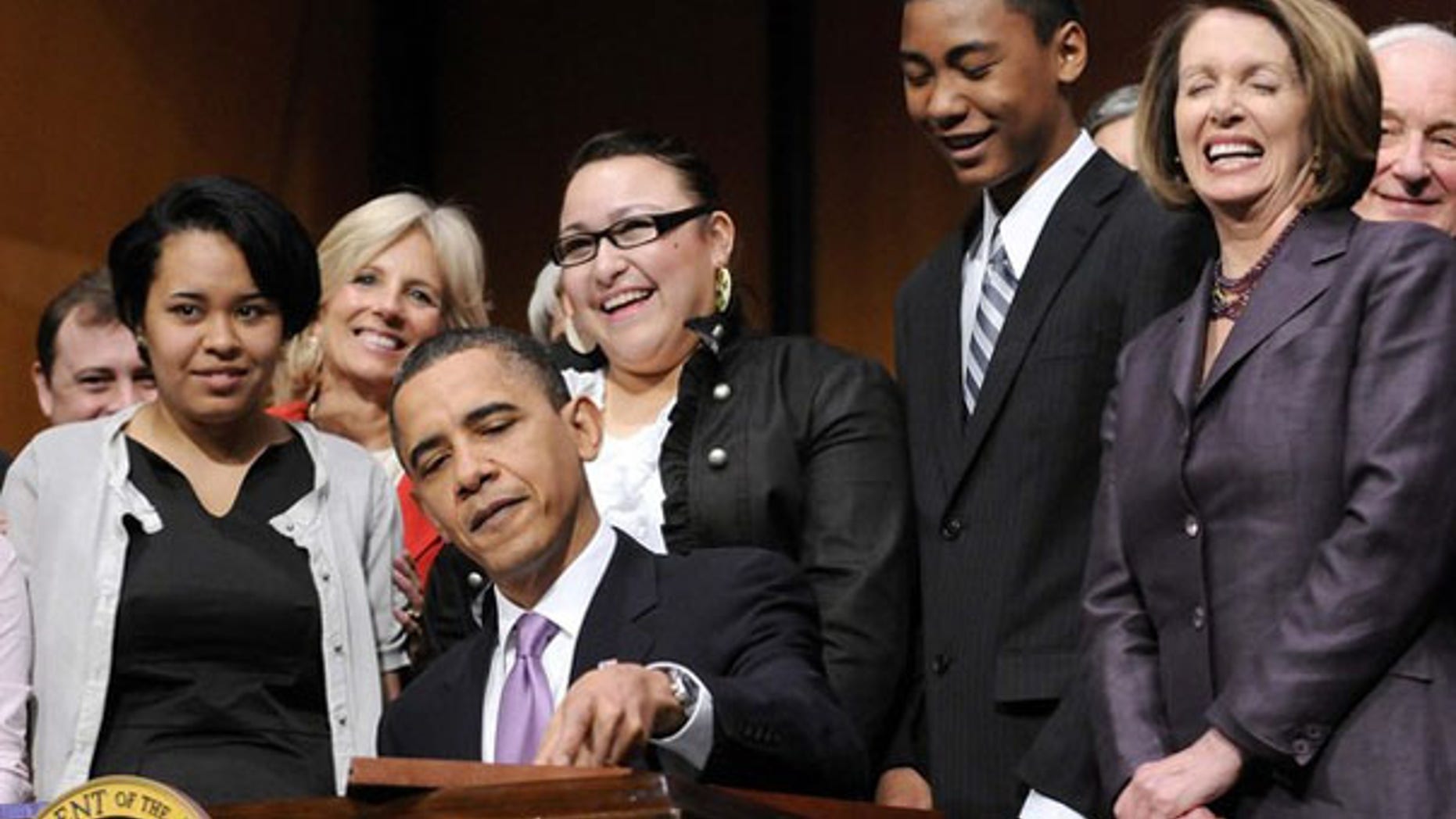 President Obama signs the Health Care and Education Reconciliation Act into law at Northern Virginia Community College in Alexandria, Va., March 30. (Reuters Photo)
