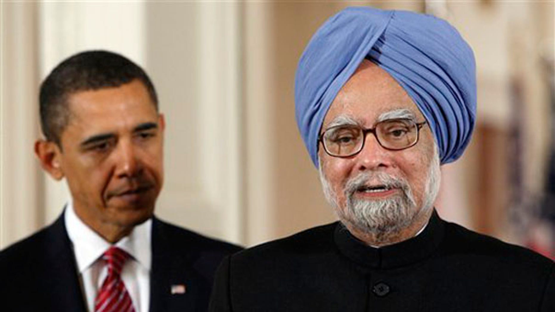 Tuesday: Prime Minister Manmohan Singh of India delivers his welcome address as President Obama listens during a state arrival ceremony in the East Room of the White House. (AP Photo)