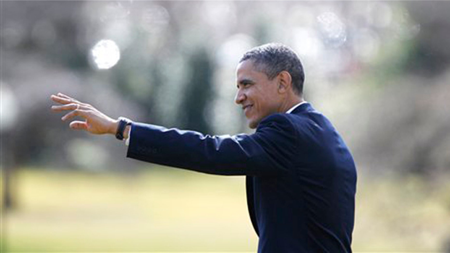 Feb. 23, 2012: President Obama walks on the South Lawn at the White House as he travels to Florida.