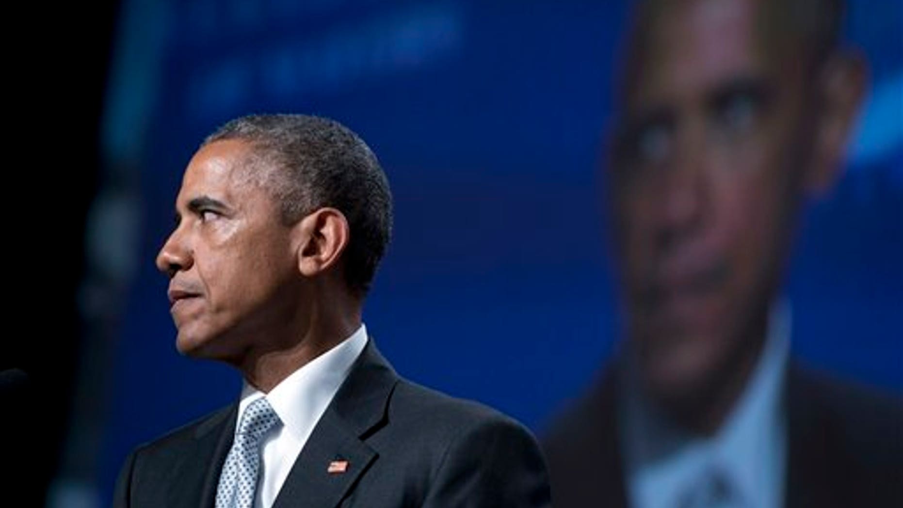 June 19: President Obama pauses as he speaks about gun violence at the Annual Meeting of the U.S. Conference of Mayors in San Francisco. (AP Photo/Carolyn Kaster)