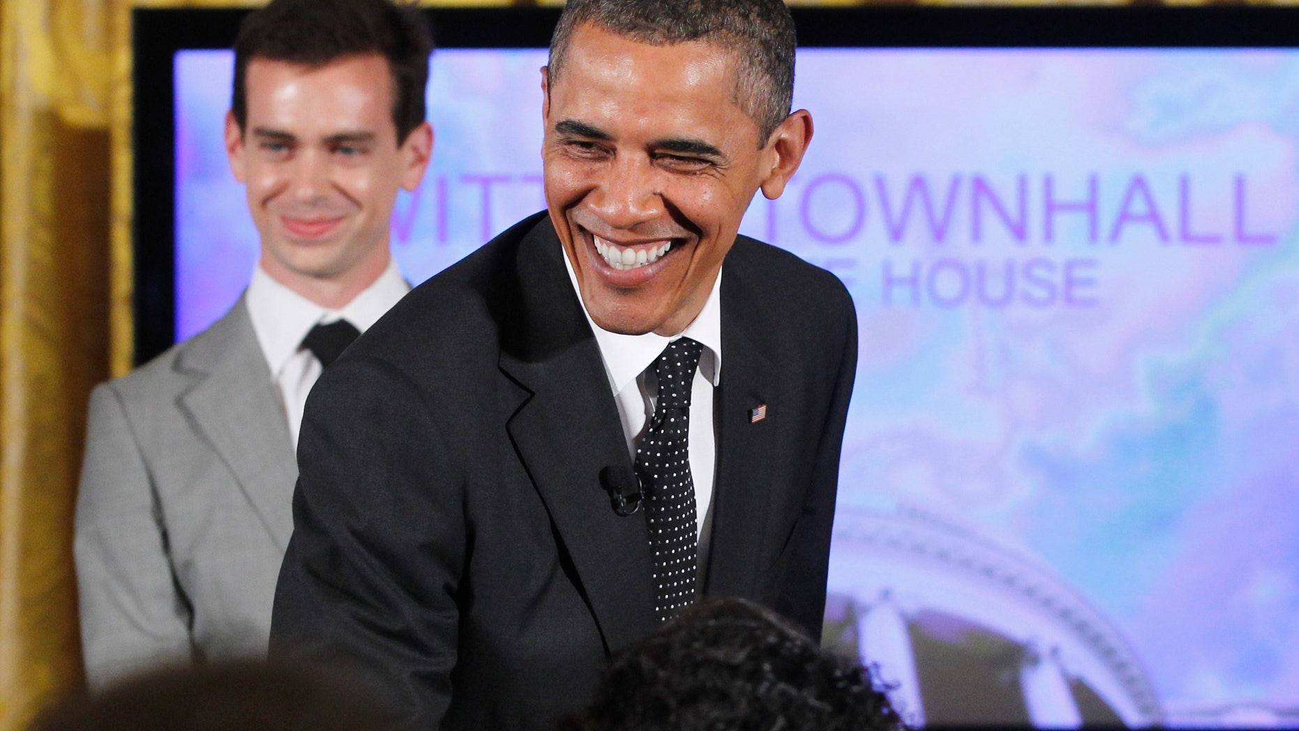 President Obama used a gun metaphor to describe debt talks with Republicans during a Twitter Town Hall in the East Room of the White House in Washington, Wednesday, July 6, 2011.