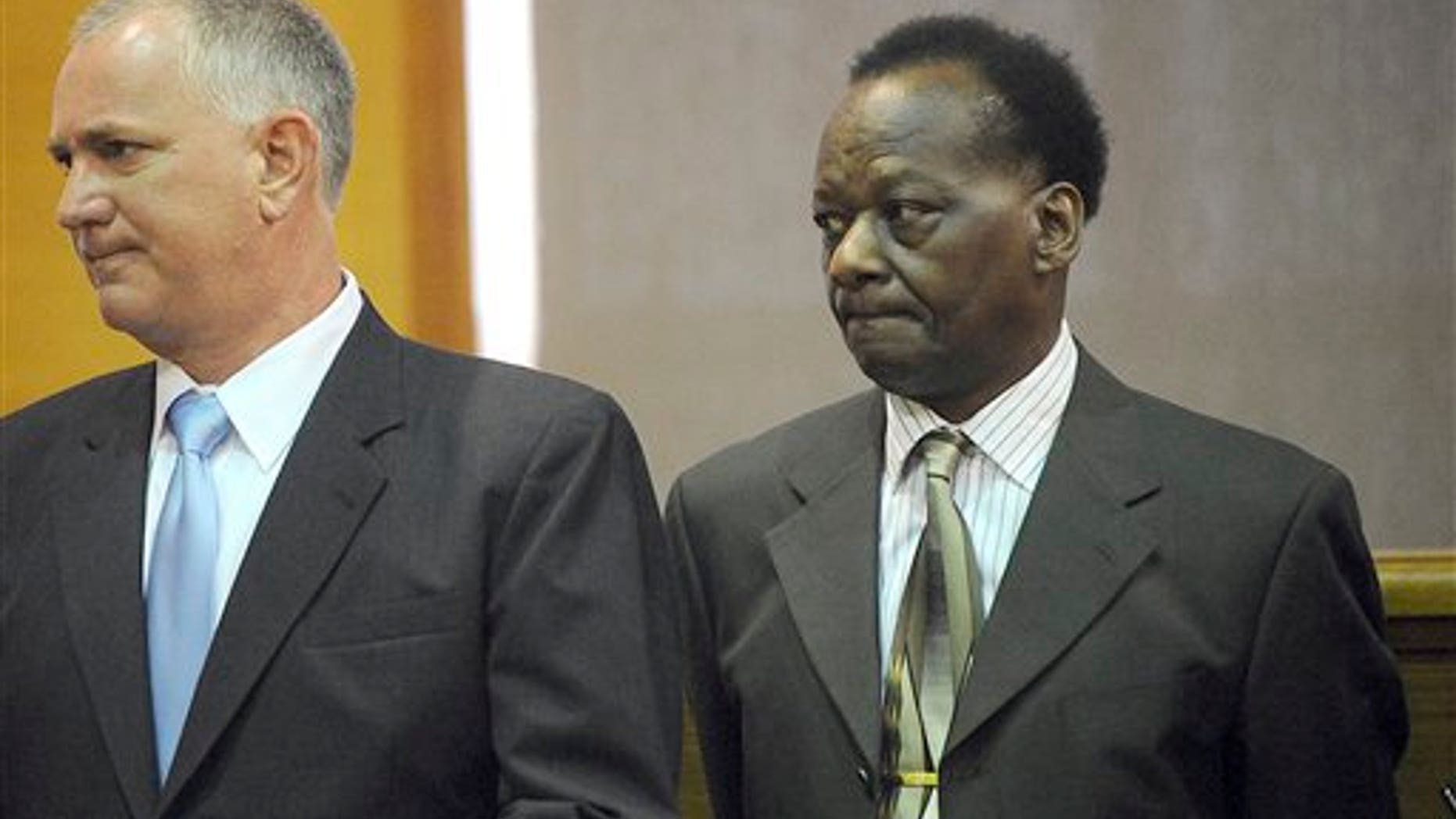 Sept. 29: Onyango Obama, right, uncle of President Barack Obama, waits with defense attorney Scott Bratton in Framingham, Mass., District Court, during a hearing on an August drunken driving charge.