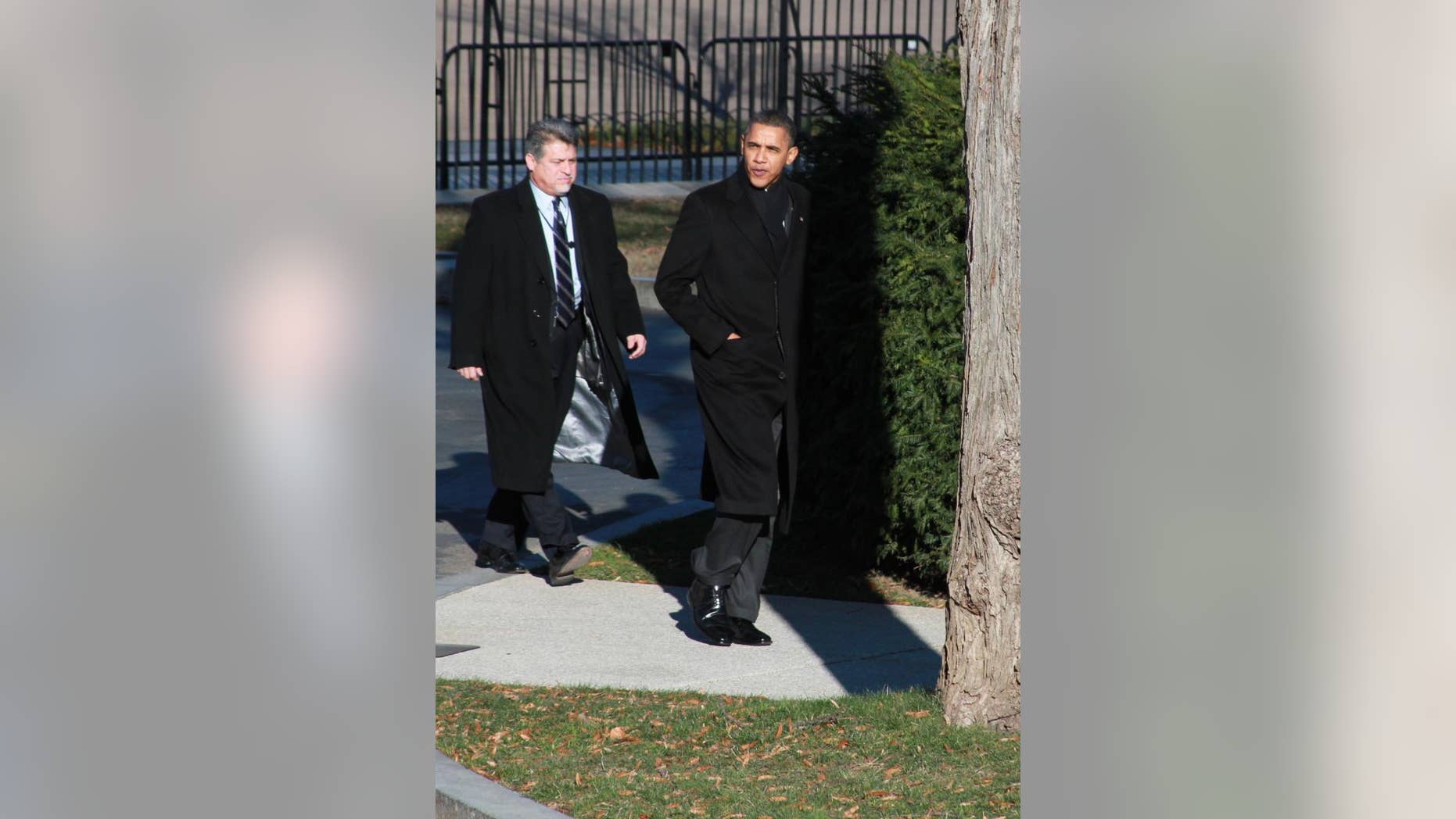 President Obama walks back to the White House after meeting with CEOs at Blair House Wednesday. (Fox News Photo)