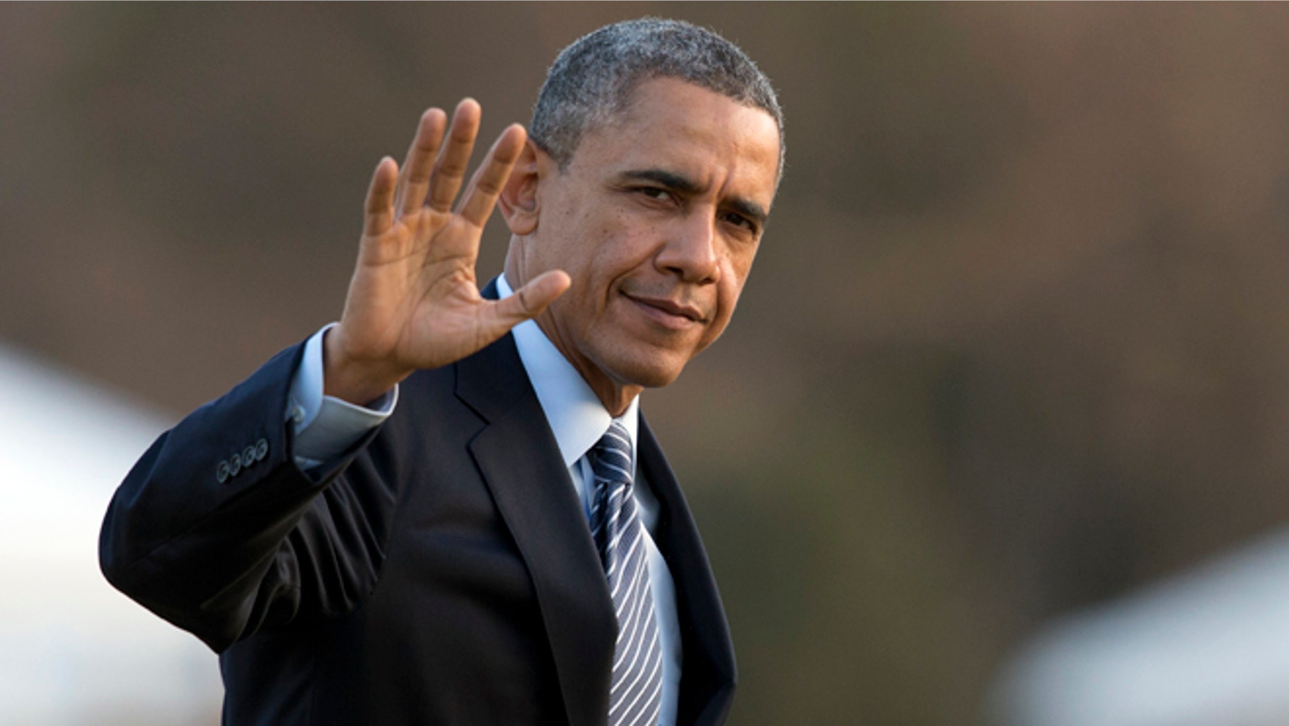Feb. 7, 2014: President Obama waves as he arrives at the White House.