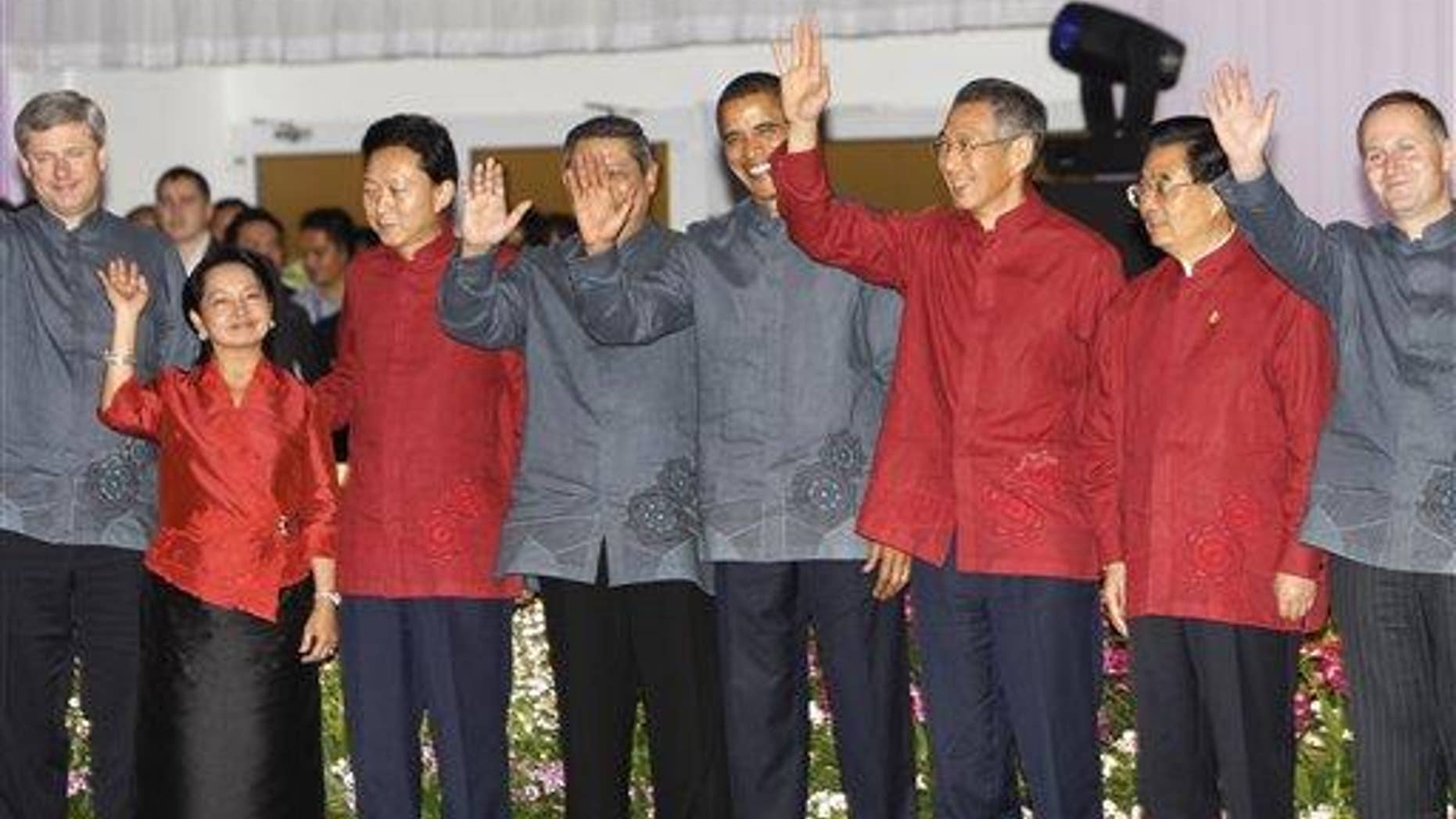 President Obama poses with other APEC leaders for their official group photo during the Gala Dinner at the APEC Summit in Singapore. (AP Photo)