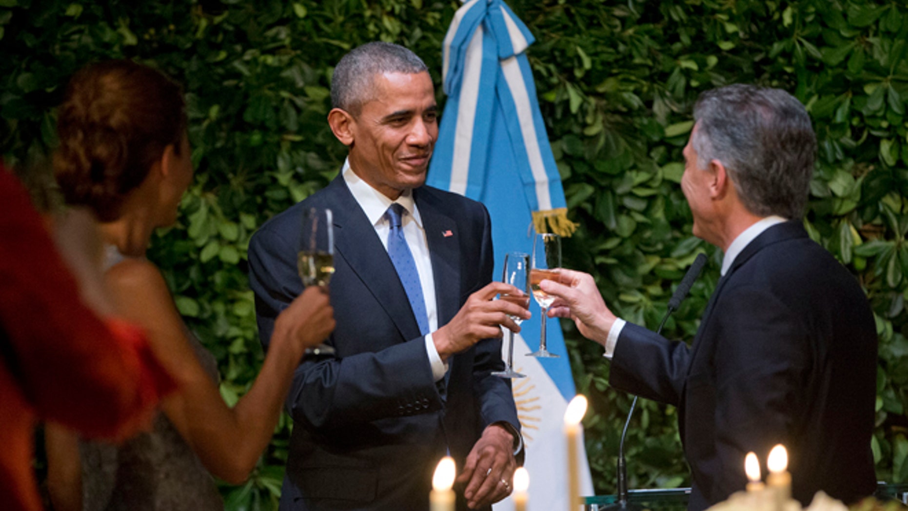 President Barack Obama and Argentinian President Mauricio Macri toast during the State Dinner at the Centro Cultural Kirchner, Wednesday, March 23, 2016, in Buenos Aires, Argentina. (AP Photo/Pablo Martinez Monsivais)