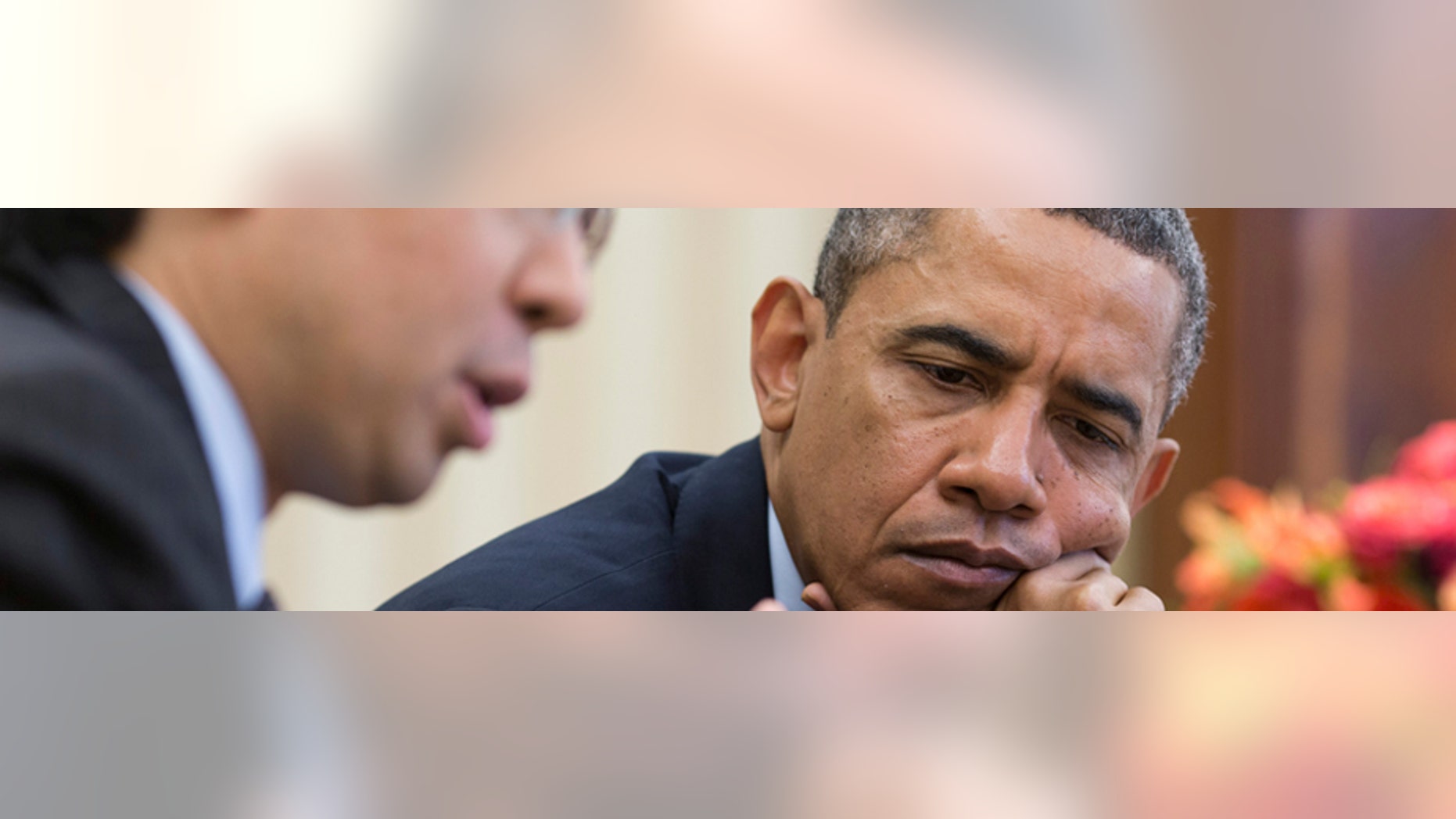President Obama watches as Todd Park (L), Assistant to the president and Chief Technology Officer, shows him information on a tablet during a meeting in the Oval Office, in this April 15, 2013 handout photograph obtained on October 24, 2013. Park, the chief technology officer for the White House and a top adviser to Obama, now finds himself among a handful of officials with targets on their backs as Republicans try to root out who is responsible for the glitch-ridden rollout of Healthcare.gov.