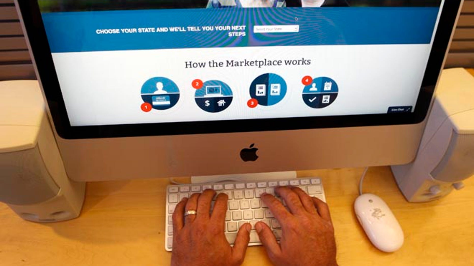 A man looks over the Affordable Care Act signup page on the HealthCare.gov website in New York in this October 2013 file photo.