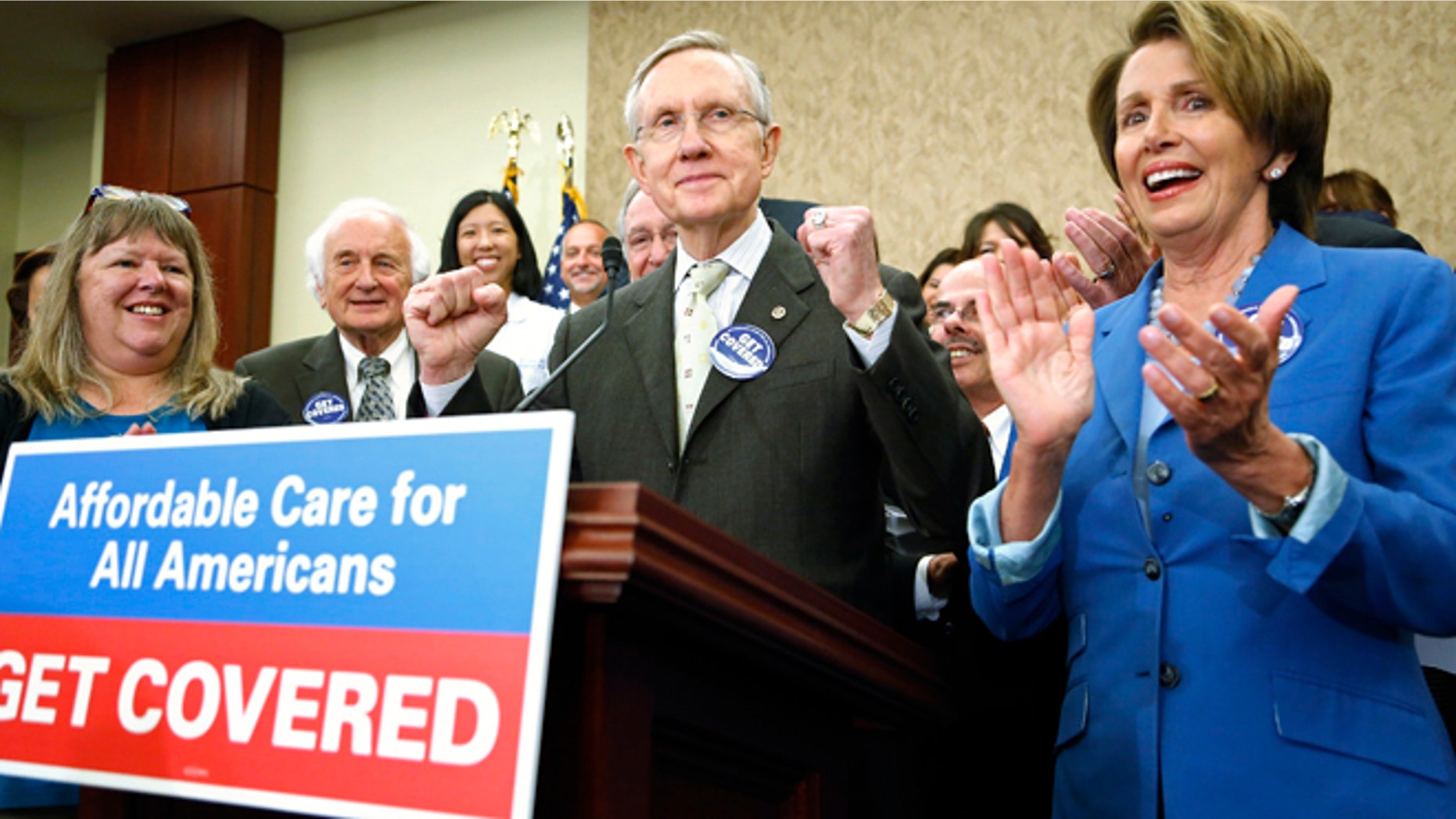 Oct. 1, 2013: U.S. Senate Democratic leader Harry Reid (C) and House Minority Leader Nancy Pelosi (R) lead a rally to celebrate the start of the Affordable Care Act (commonly known as Obamacare) at the U.S. Capitol in Washington.
