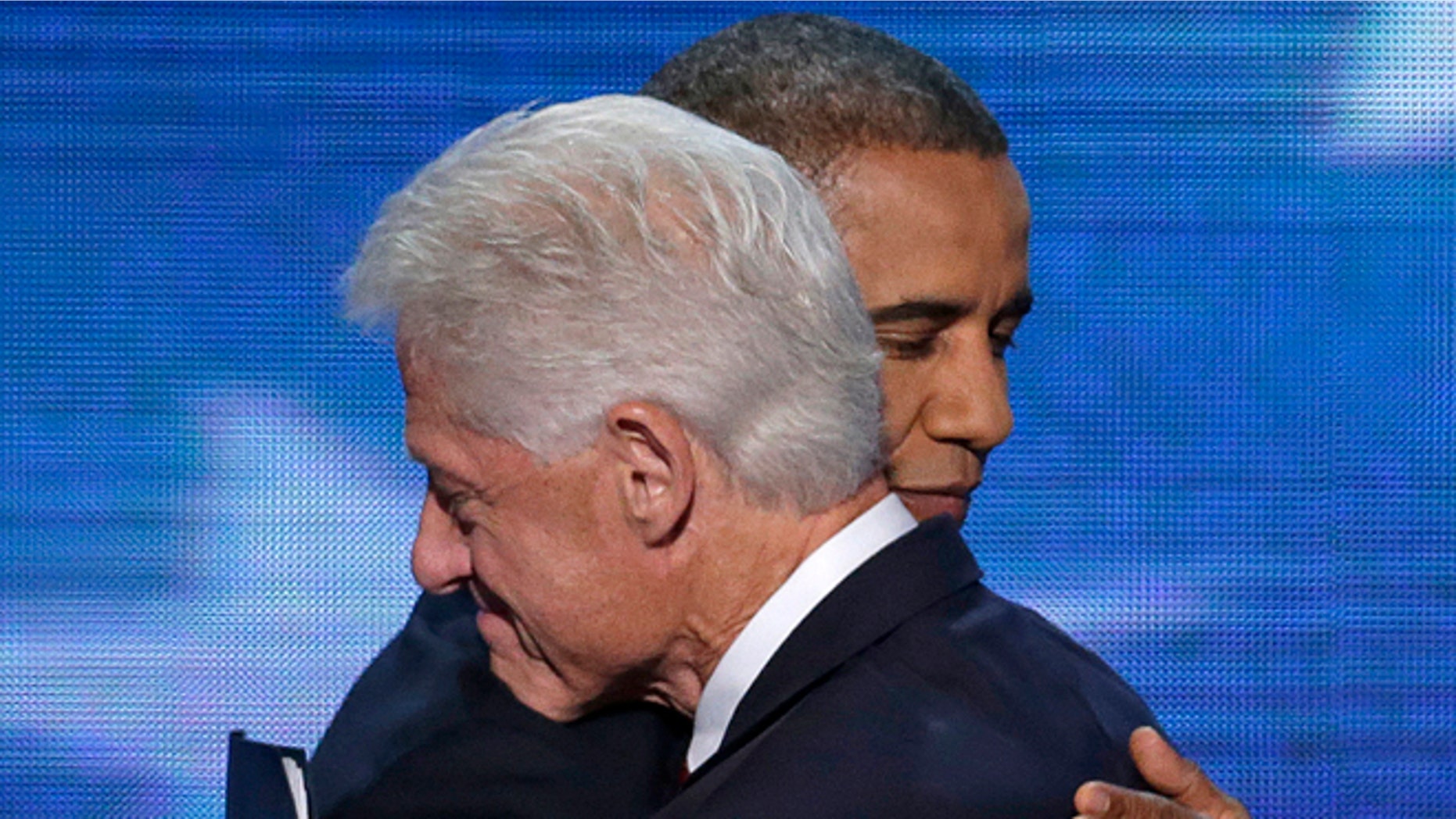 Sept. 5, 2012: Former President Bill Clinton hugs President Barack Obama after President Obama walked on stage after Clinton's speech the Democratic National Convention in Charlotte, N.C.