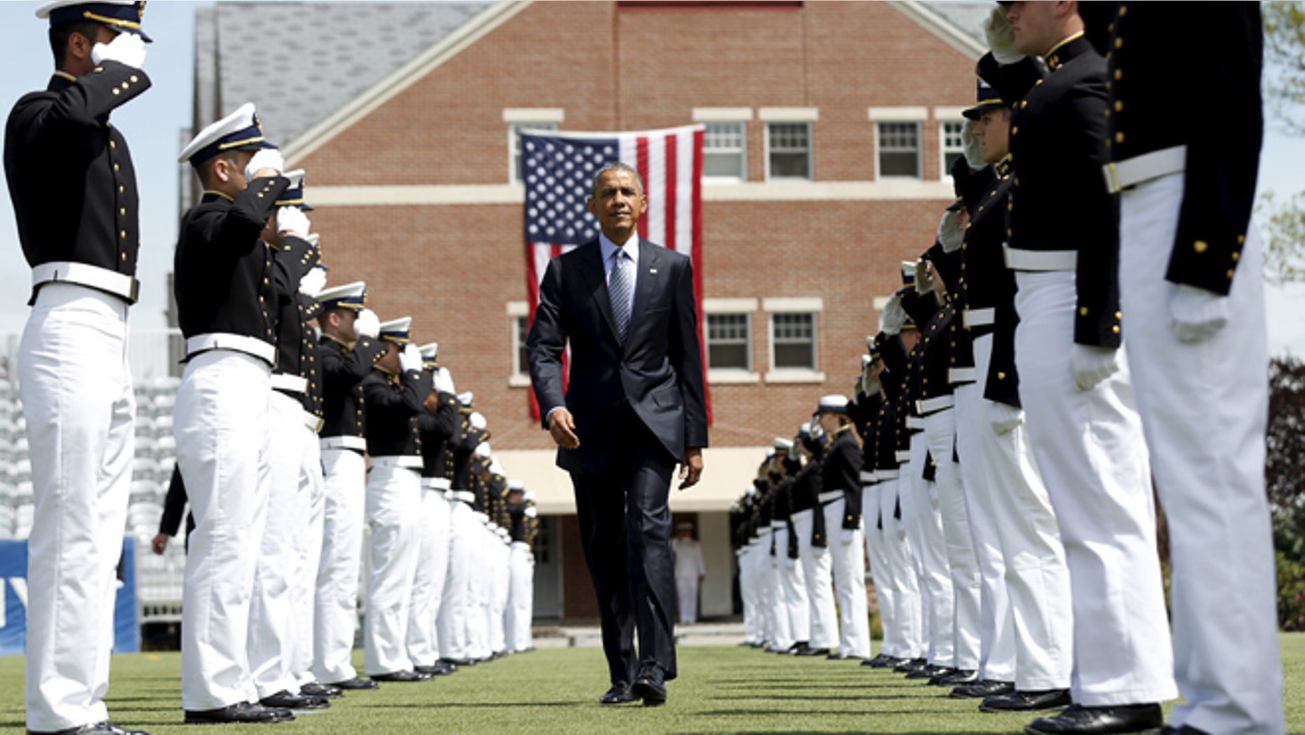 President Obama walks through an honor cordon as he arrives for the 134th Commencement Exercises of the United States Coast Guard Academy in New London, Ct.