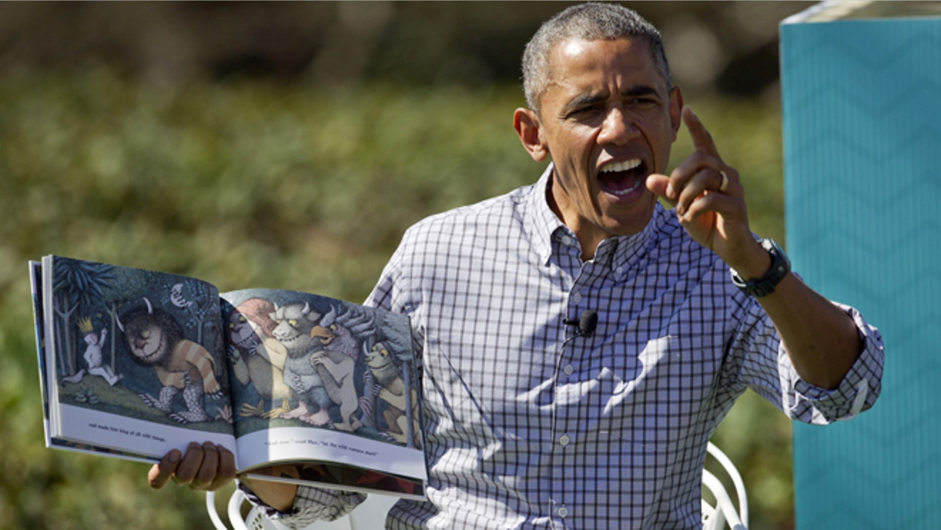April 6, 2015: President Obama reads "Where the Wild Things Are" by Maurice Sendak, during the White House Easter Egg Roll on the South Lawn of the White House is Washington.