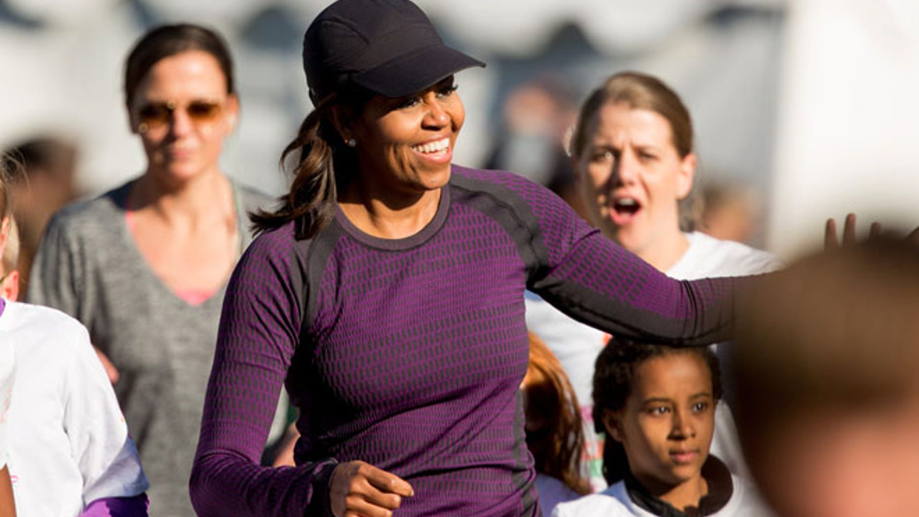 Mar. 26, 2016: First lady Michelle Obama gets greeted from the audience as she participates in her first ever "fun run" with children on the South Lawn of the the White House in Washington as part of her focus of healthy lifestyles for children.