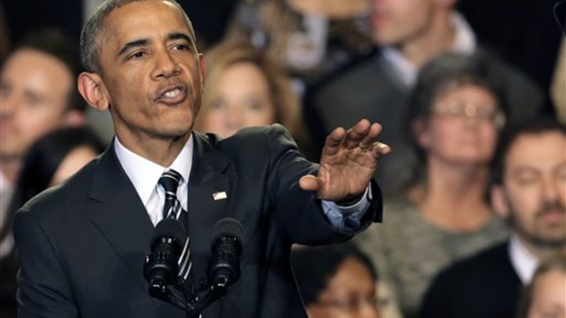 Nov. 25, 2014: President Barack Obama tries to quiet one of three hecklers as he addresses the crowd after meeting with community leaders about the executive actions he is taking to fix the immigration system.