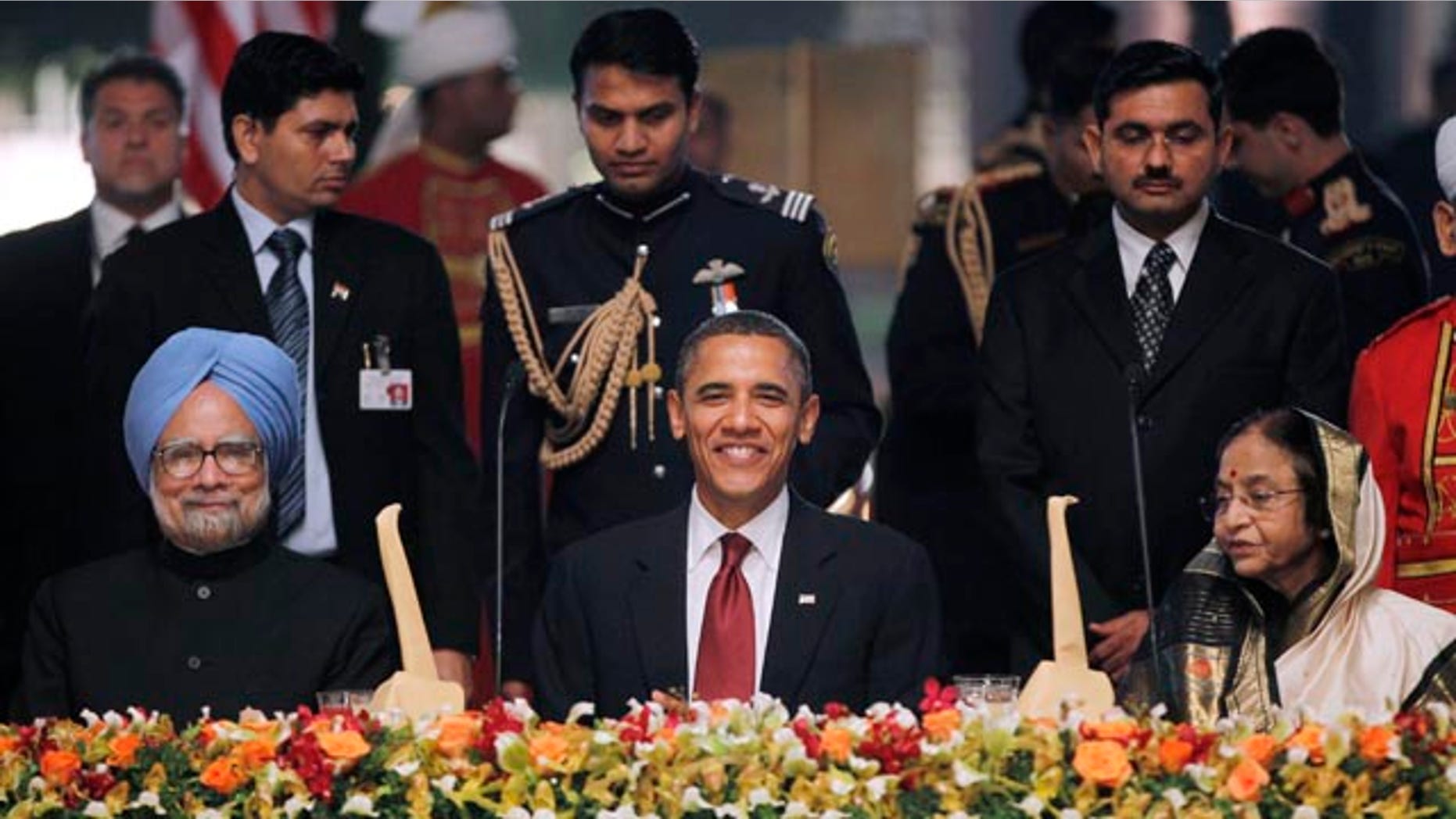Nov. 8: Obama sits between India's President Prathiba Patil, right, and India's Prime Minister Manmohan Singh at a state dinner in New Delhi, India.