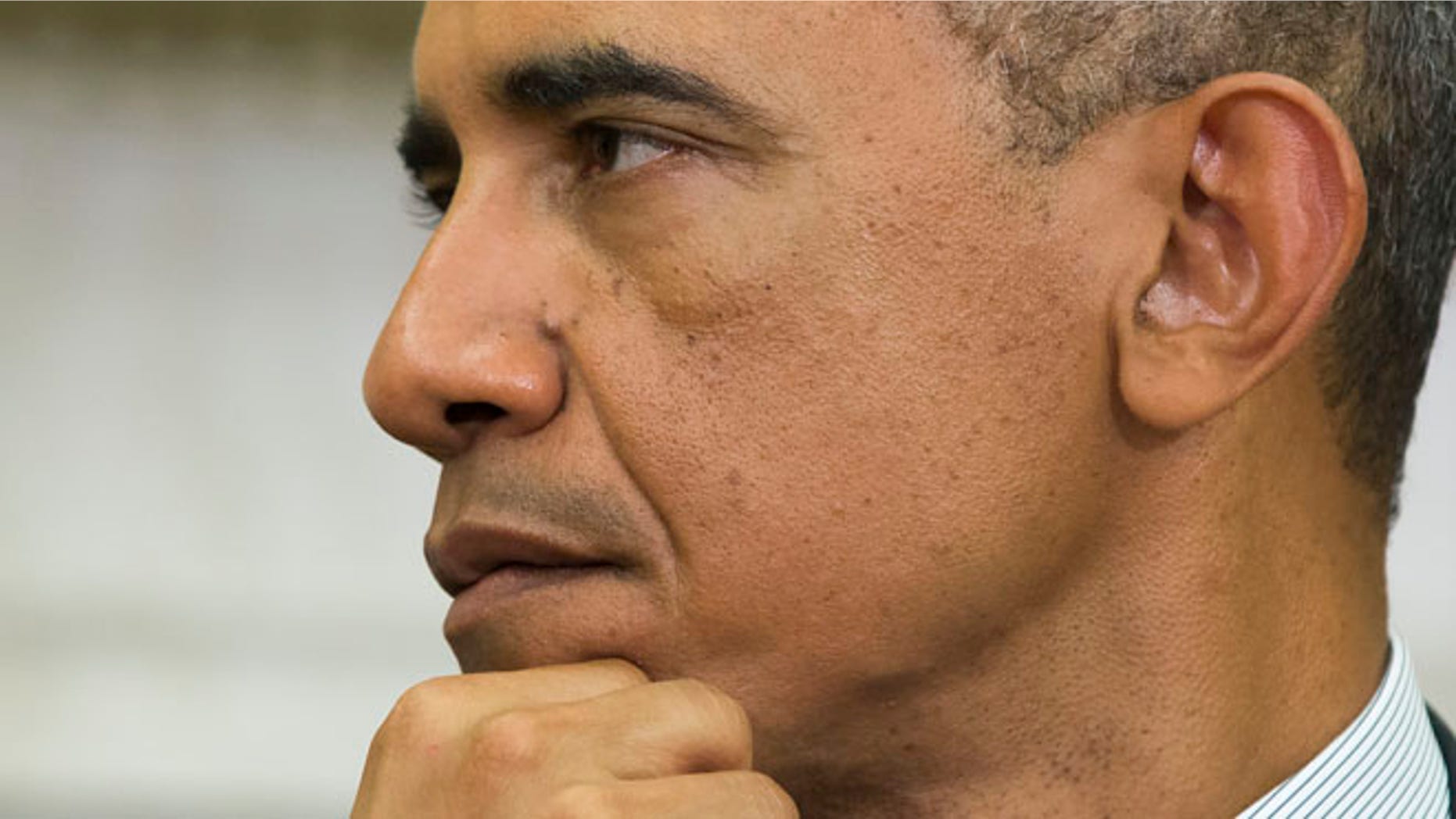 Sept 18, 2014: President Barack Obama listens to Ukrainian President Petro Poroshenko speak after a meeting in the Oval Office of the White House. (AP)