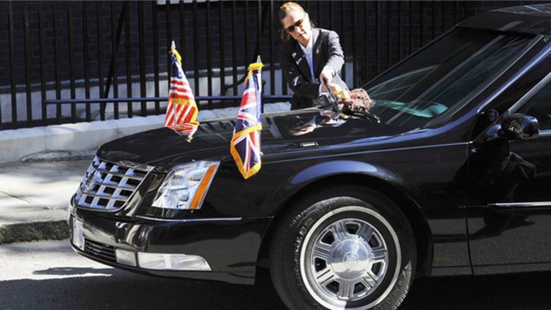 The armoured limousine of U.S. President Barack Obama is cleaned outside the 10 Downing Street residence of Britain's Prime Minister David Cameron in London May 25, 2011.