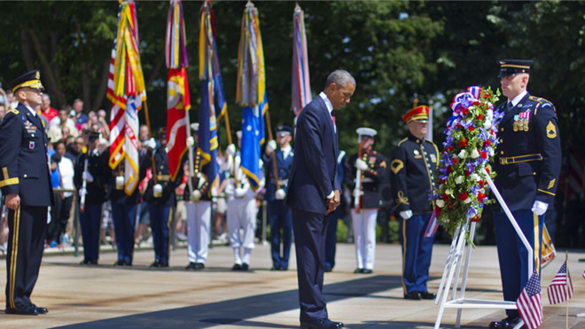 May 25, 2015: President Obama, center accompanied by Maj. Gen. Jeffrey S. Buchanan, left, Commander of the U.S. Army Military District of Washington, and Sgt. 1st Class John C. Wirth, right.