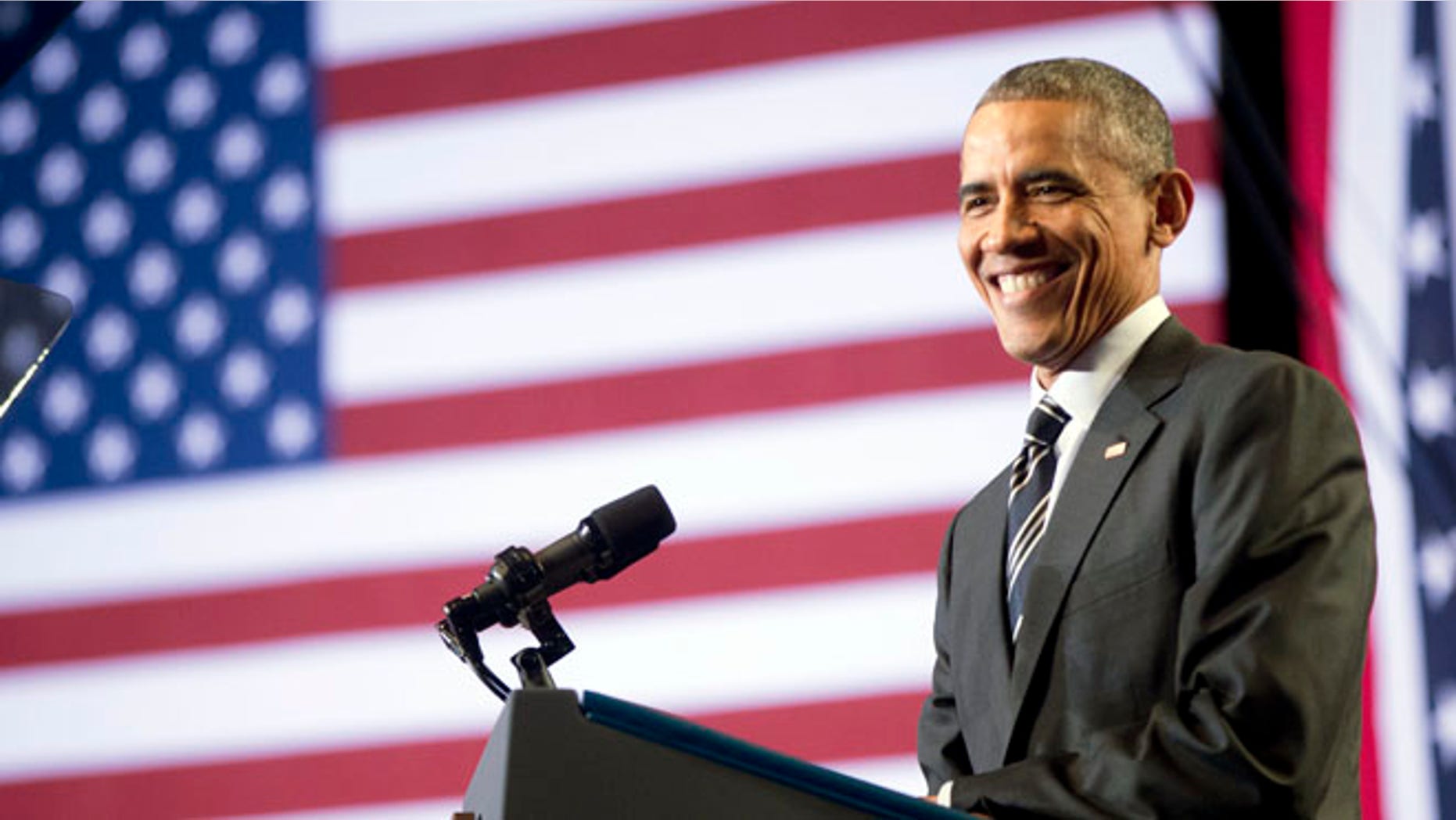 Nov. 25, 2014: President Barack Obama smiles while speaking at the Copernicus Community Center in Chicago to discuss immigration reform. (AP)