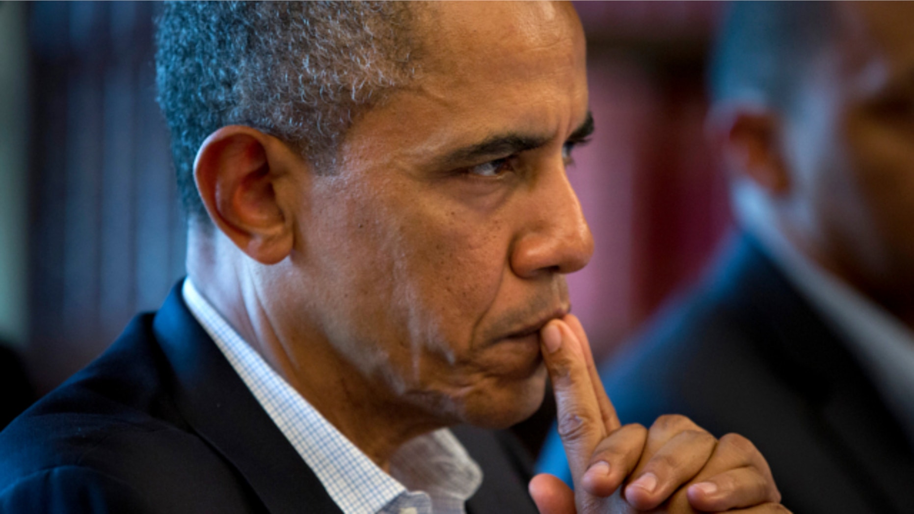 June 18, 2013: President Barack Obama listens to French President Francois Hollande during the G-8 summit at the Lough Erne golf resort in Enniskillen, Northern Ireland.