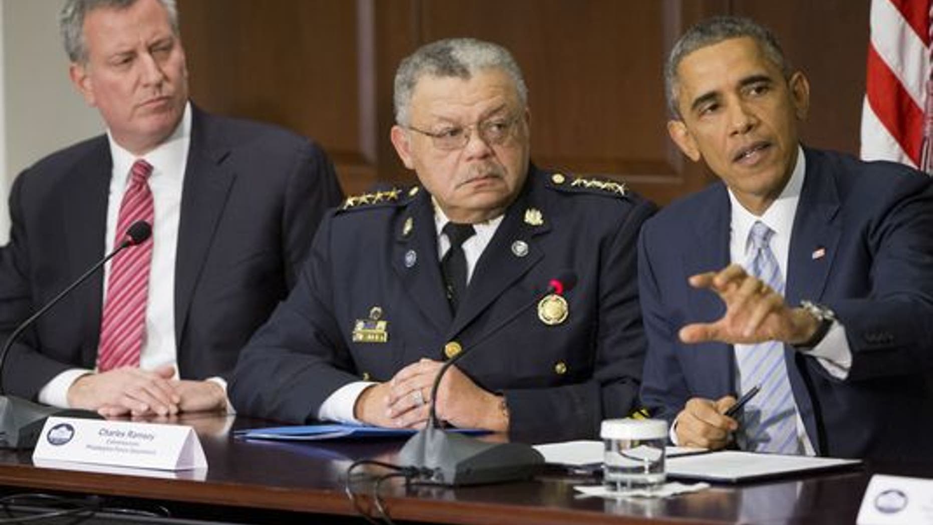 President Obama speaks during his meeting with elected officials, law enforcement officials and community and faith leaders in Washington on Monday. New York Mayor Bill de Blasio is left, and Charles Ramsey, Philadelphia police commissioner, is center. (AP Photo)