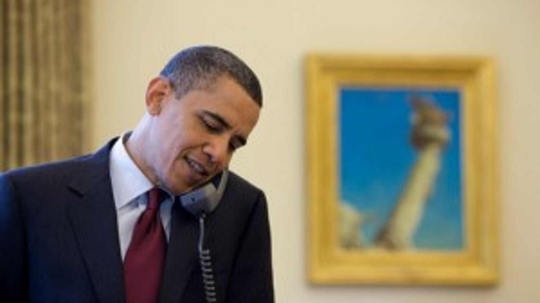President Barack Obama talks on the phone with Associate Justice John Paul Stevens, in the Oval Office, after announcing that he would be retiring from the Supreme Court, April 9, 2010. (Official White House Photo by Pete Souza)