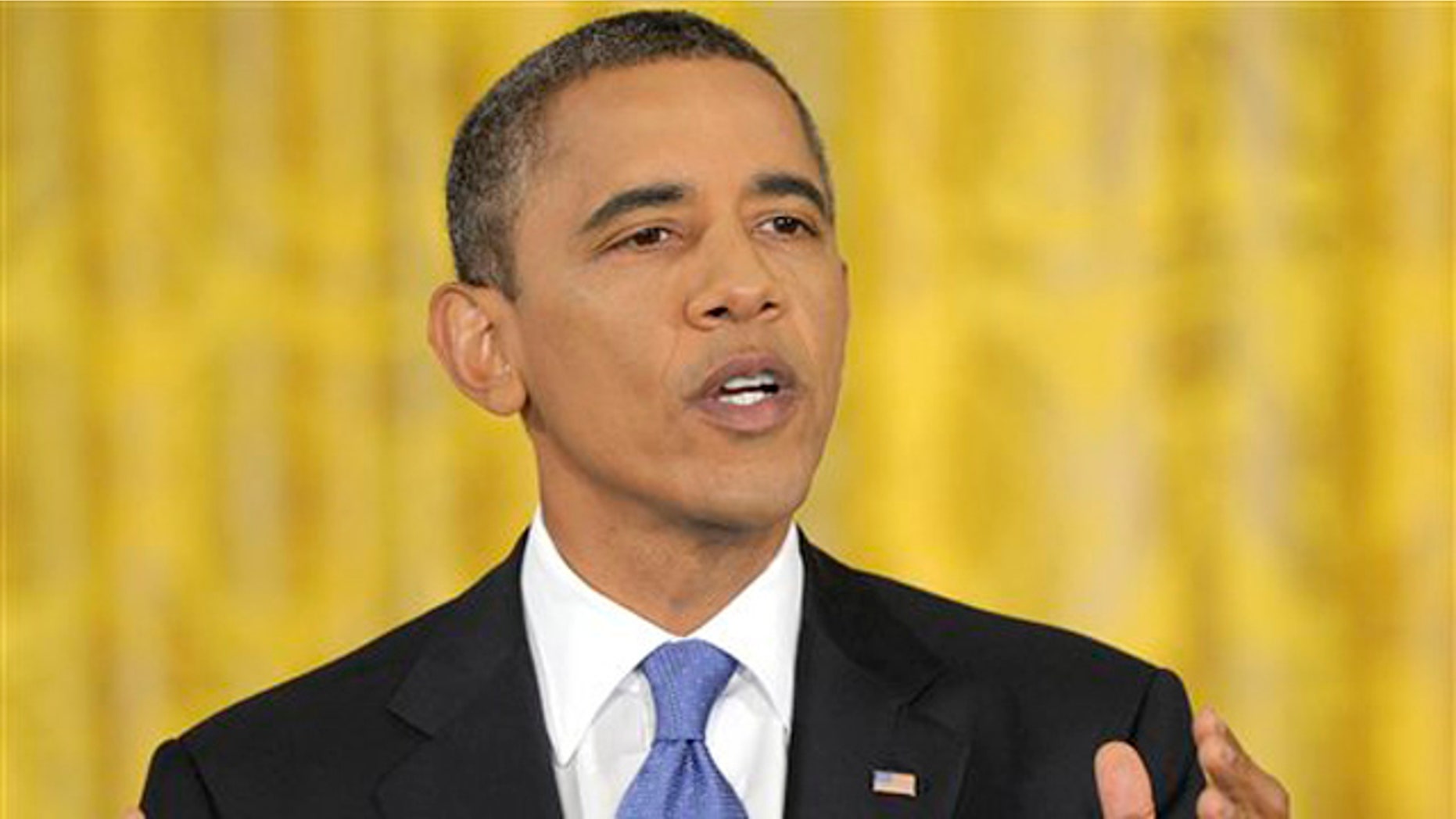President Barack Obama gestures during a news conference in the East Room of the White House in Washington, Thursday, Oct. 6, 2011.