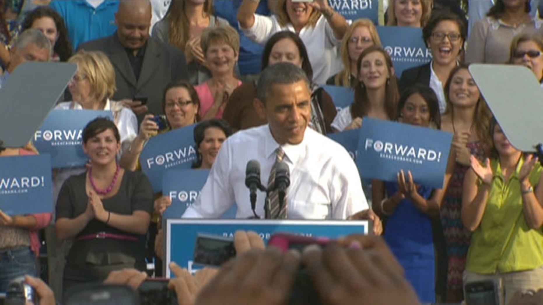 PLAY 'FIND THE GUYS': President Obama revs up a Tampa crowd on Oct. 25, 2012, with women supporters filling up the risers behind him -- as both candidates appeal to female voters.