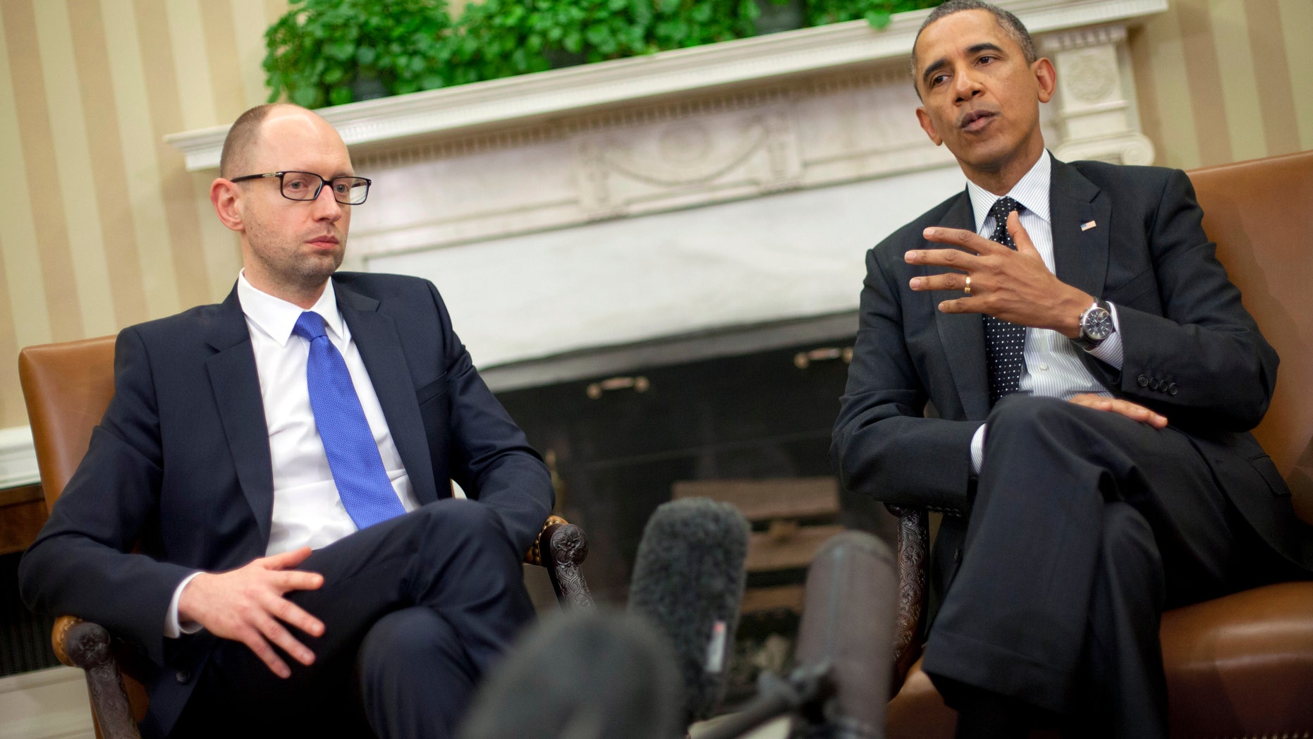 March 12, 2014: President Barack Obama, right, with Ukraine Prime Minister Arseniy Yatsenyuk, left, talk in the Oval Office of the White House in Washington.