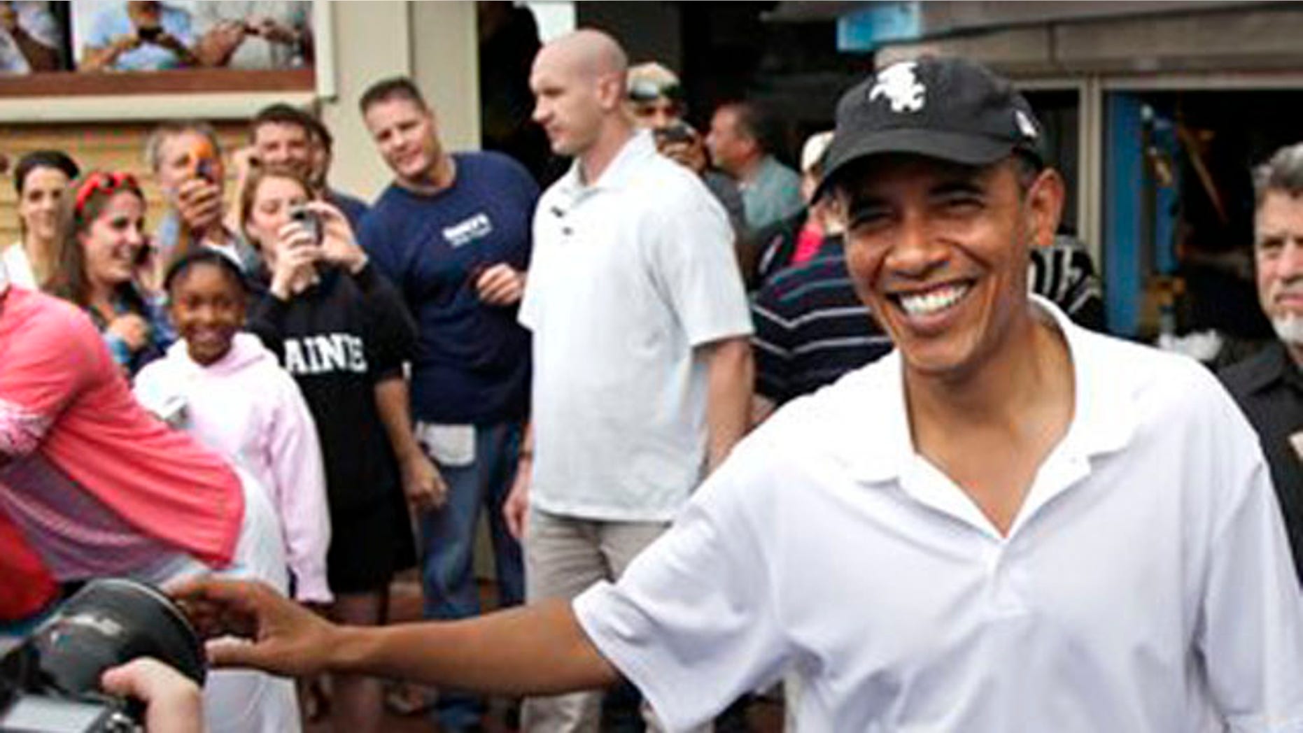 Aug. 25, 2010: President Obama greets people outside Nancy's Restaurant in Oak Bluffs, Mass., while the first family is vacationing on Martha's Vineyard.
