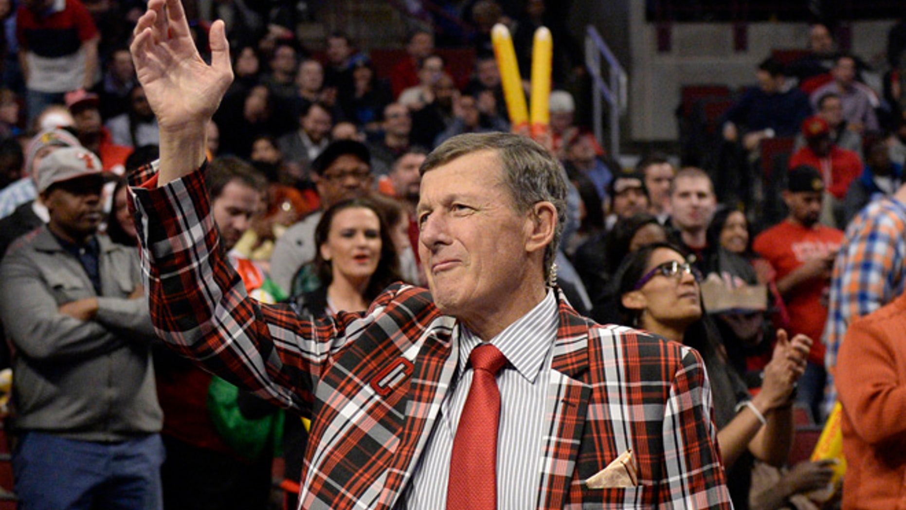 FILE - In this March 5, 2015, file photo, Craig Sager acknowledges the crowd during a timeout in an NBA basketball game between the Chicago Bulls and the Oklahoma City Thunder in Chicago.