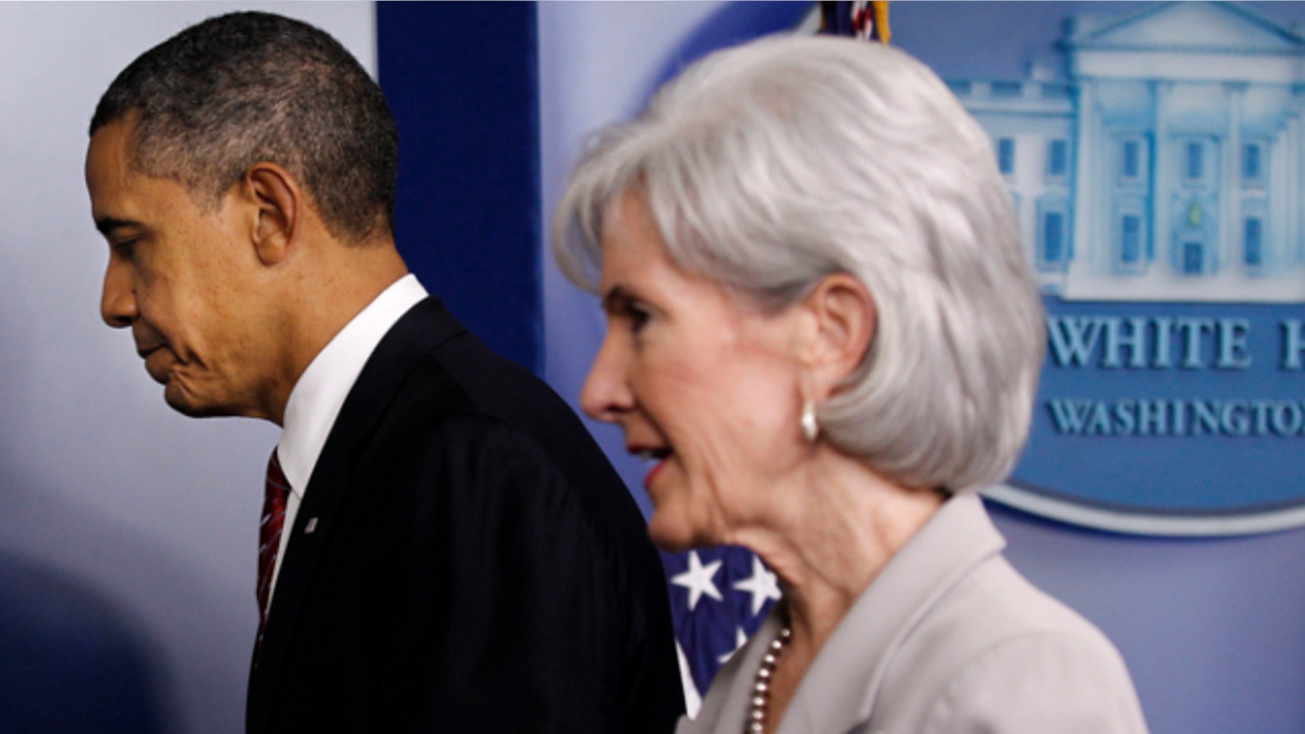 Feb. 10, 2012: President Obama and Health and Human Services Secretary Kathleen Sebelius leave the Brady Press Briefing Room of the White House in Washington.