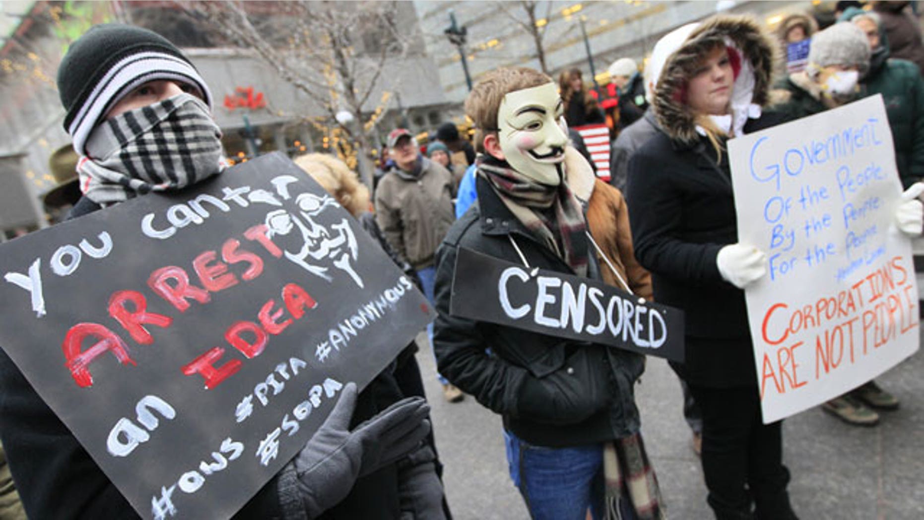 January 20, 2012: Members of Occupy Cincinnati rally on Fountain Square before marching to the Potter Stewart United States Courthouse in Cincinnati.