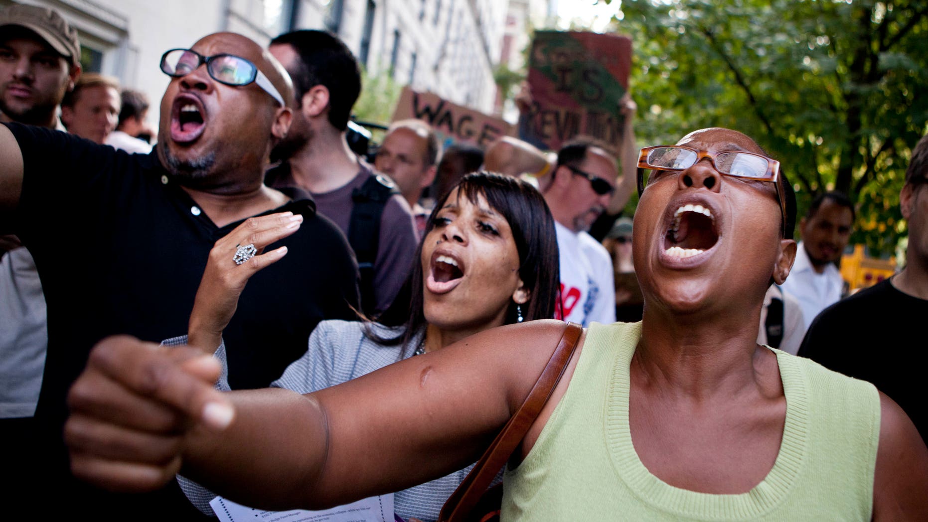 Protestors affiliated with the "Occupy Wall Street" protests chant outside 834 Fifth Avenue, where Rupert Murdoch lives, in New York, on Tuesday, Oct. 11, 2011.