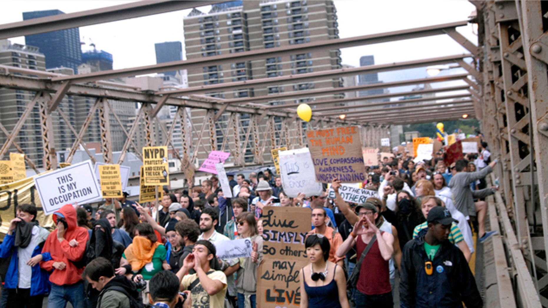 Oct. 1: Protesters walk onto New York's Brooklyn Bridge before police began making arrests during Saturday's march by Occupy Wall Street.