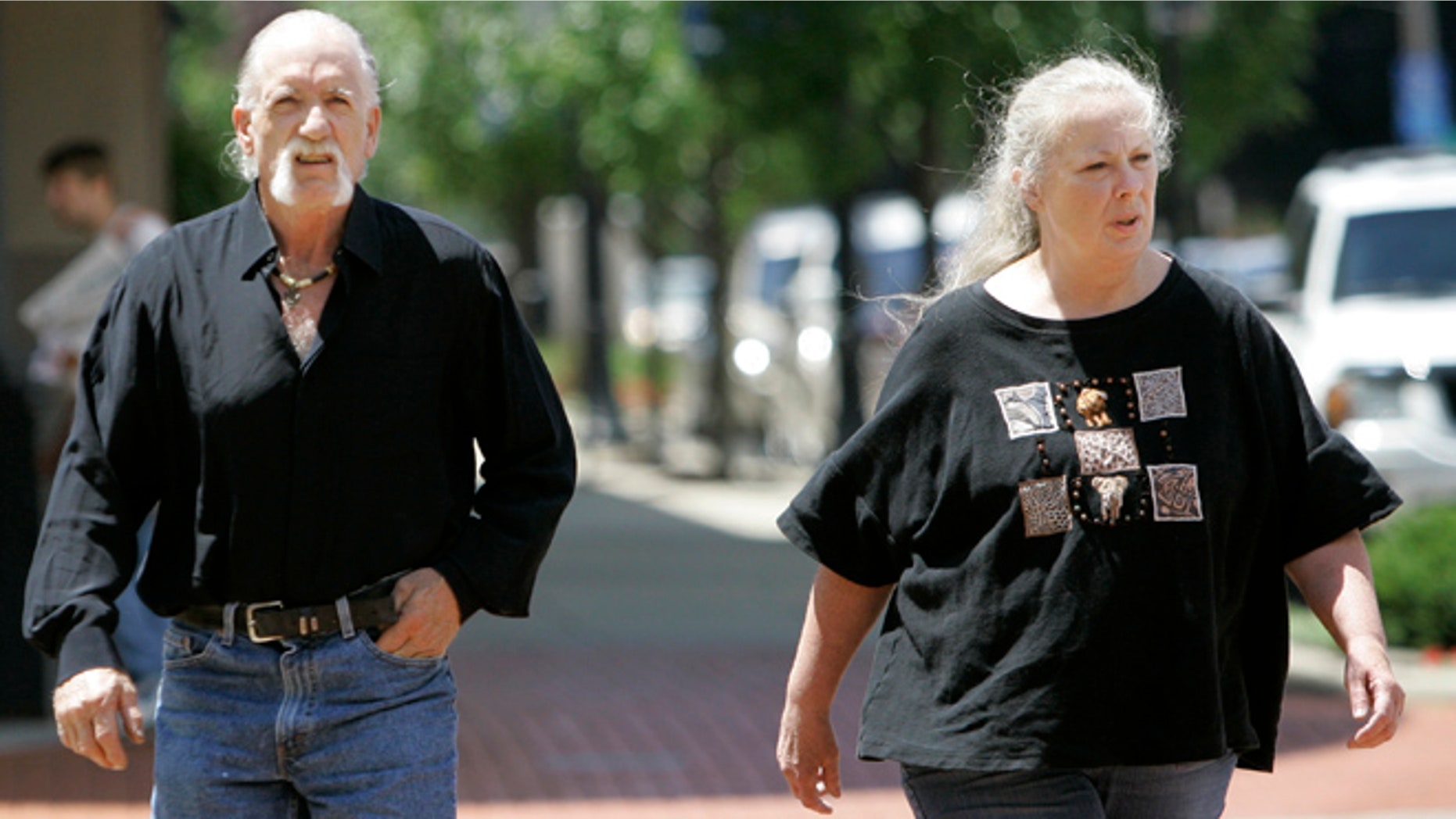 July 11, 2007: Michael and Sharen Gravelle walk through downtown Norwalk, Ohio.