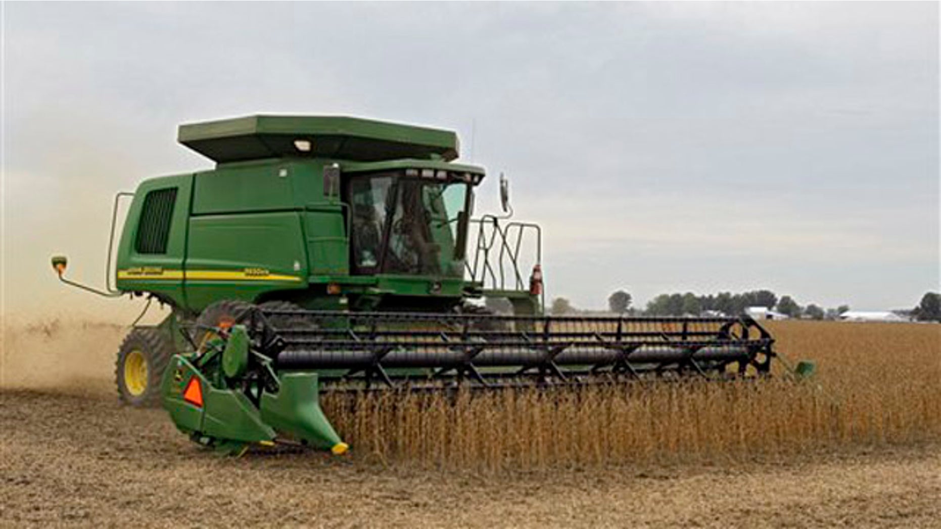 A farmer harvests soybeans in rural Erie County near Monroeville, Ohio, Oct. 10.