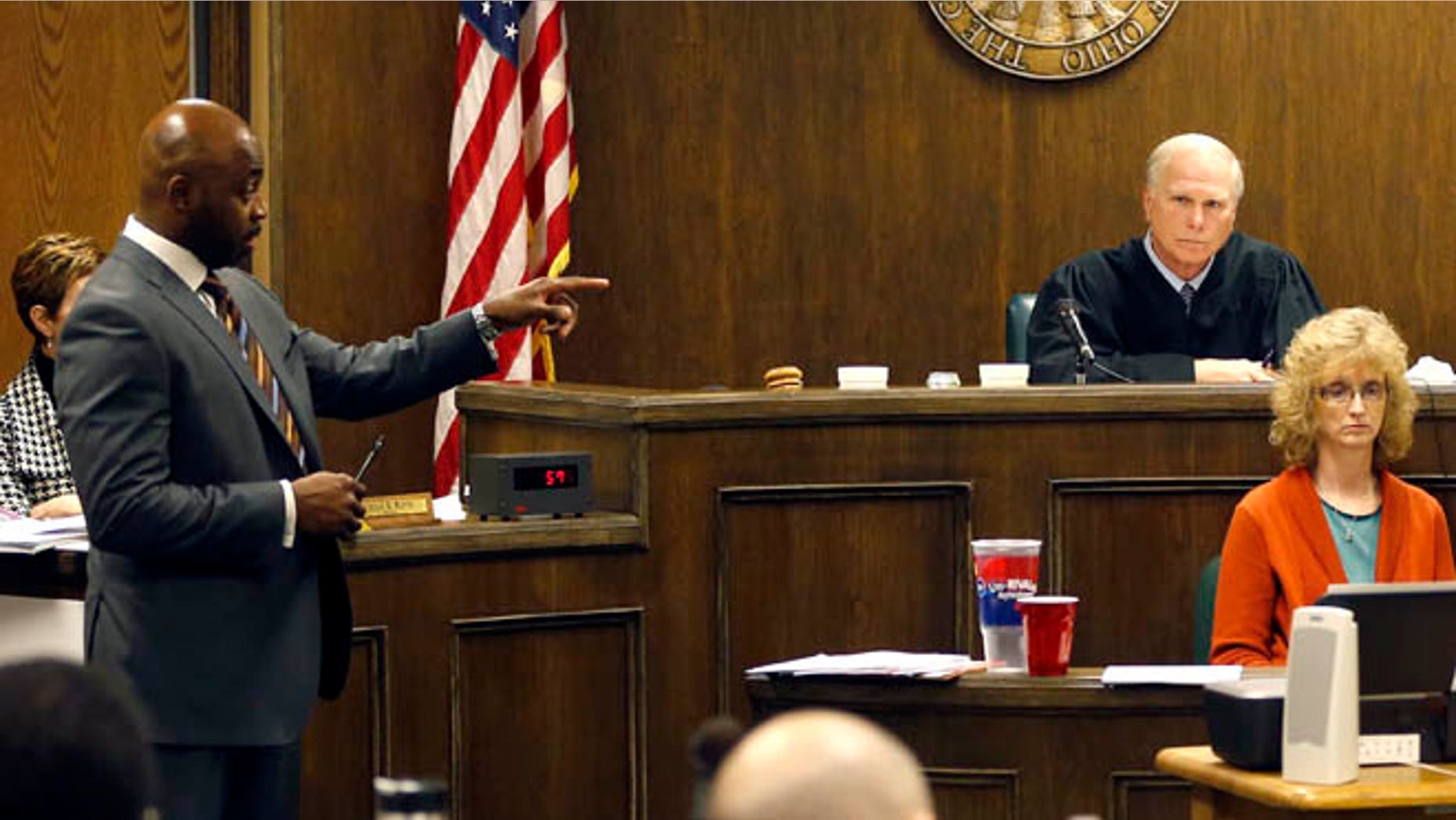 March 16, 2013: Defense attorney Walter Madison, left cross-examines states expert witness, forensic scientist Laureen Marinetta, right, as Judge Thomas Lipps, center, listens on the fourth day of the rape trial against a 17-year-old and 16-year-old in juvenile court in Steubenville, Ohio.