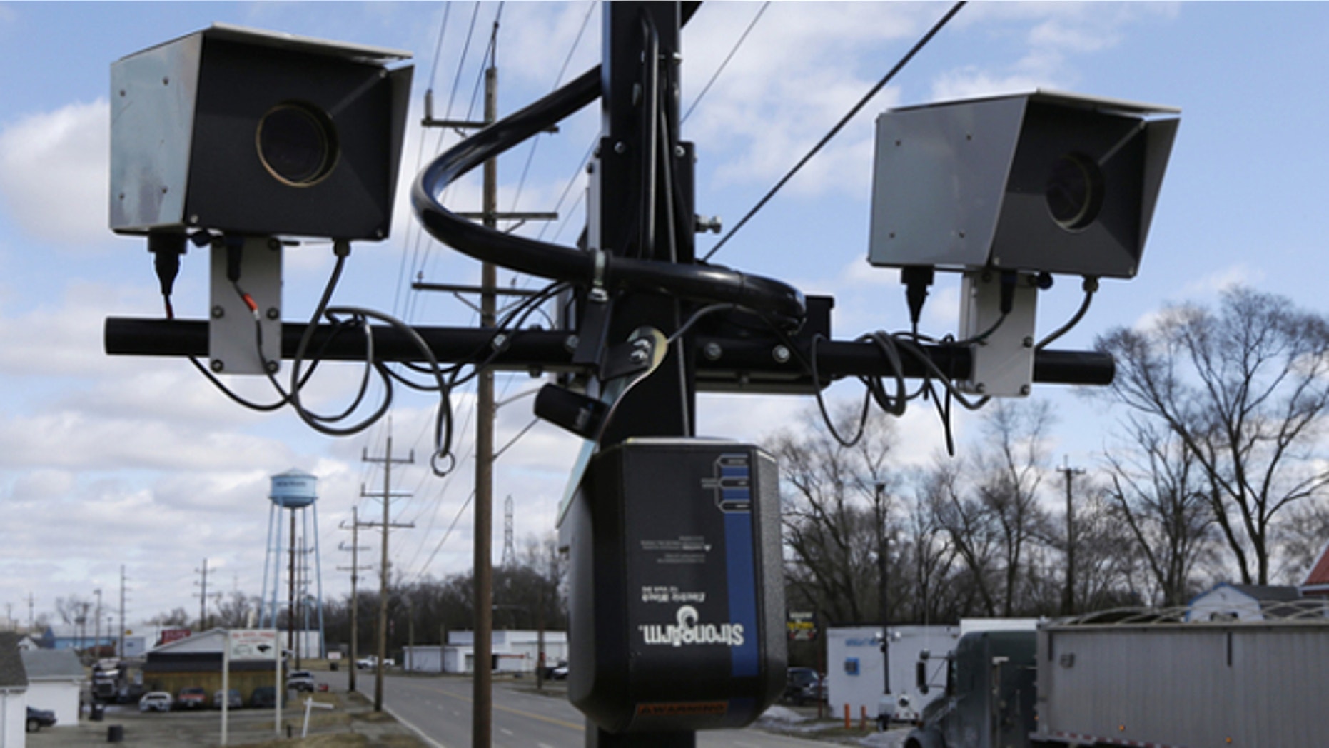 Feb. 25, 2014: Speeding cameras are aimed at traffic moving on US Route 127 in New Miami, Ohio.