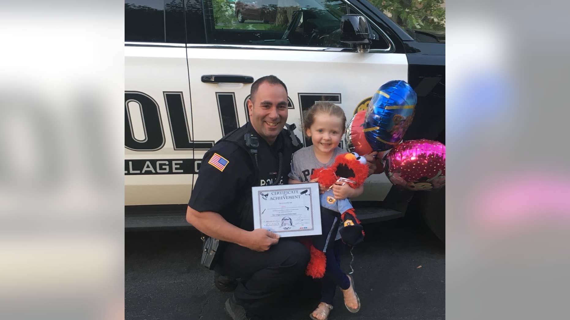Gabby, 3, gave the police officer an elmo doll so we wouldn't be alone when he was on patrol.