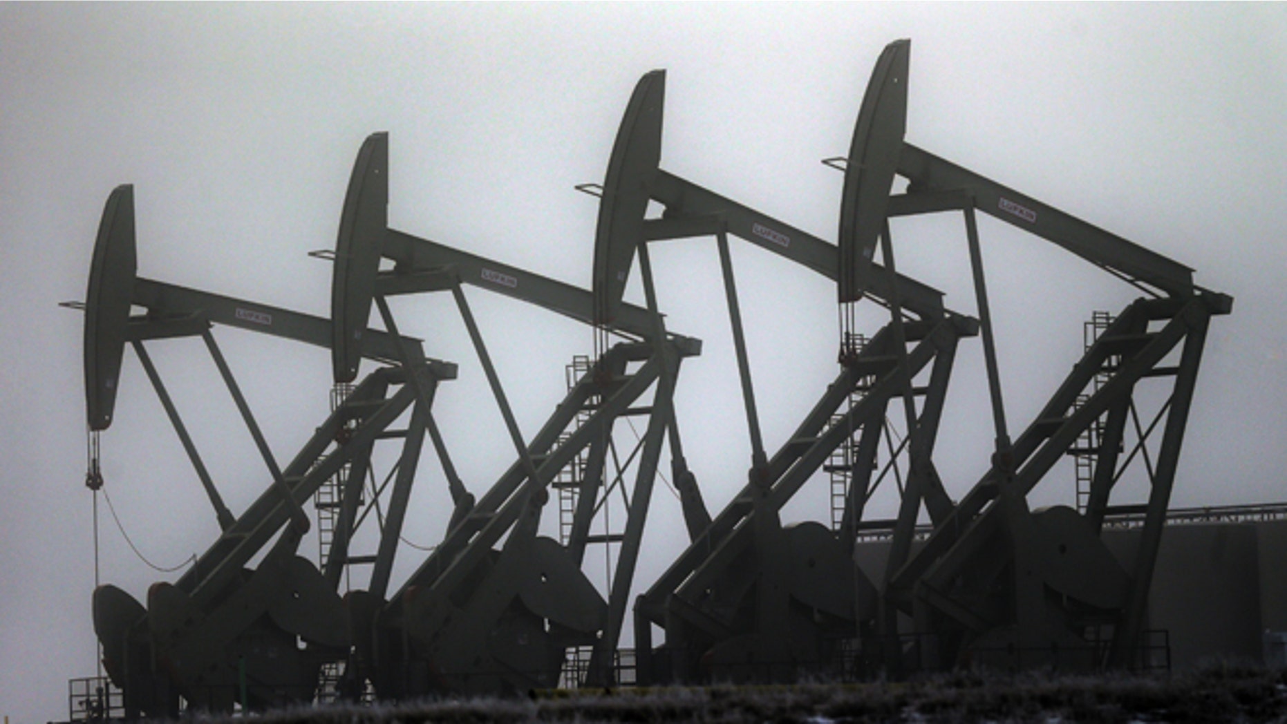 Dec. 19, 2014: Oil pump jacks are shown in Williston, N.D.