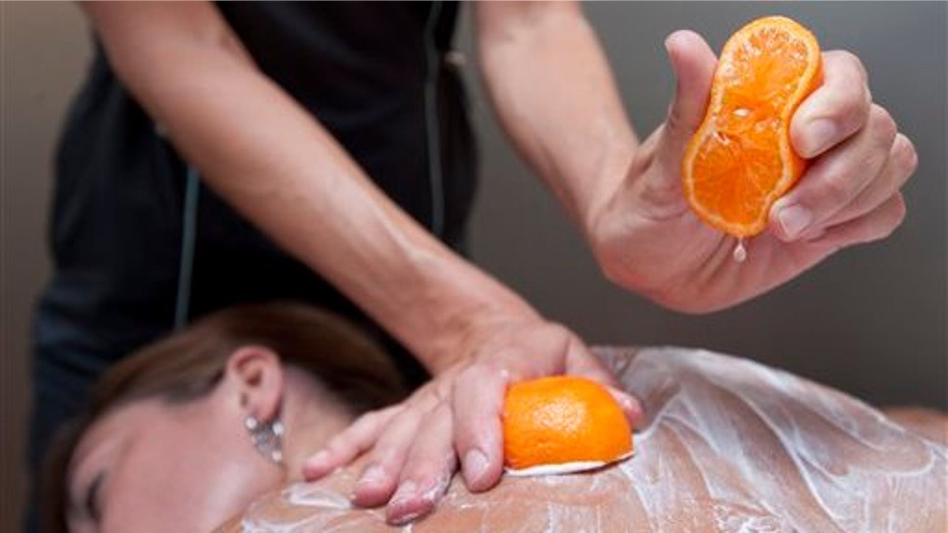 August 3: Body technician Bree Sarver demonstrates the pixie tangerine and pomegranate treatment on Andrea Olsonat the Ojai Valley Inn & Spa in Ojai, Calif. (AP)